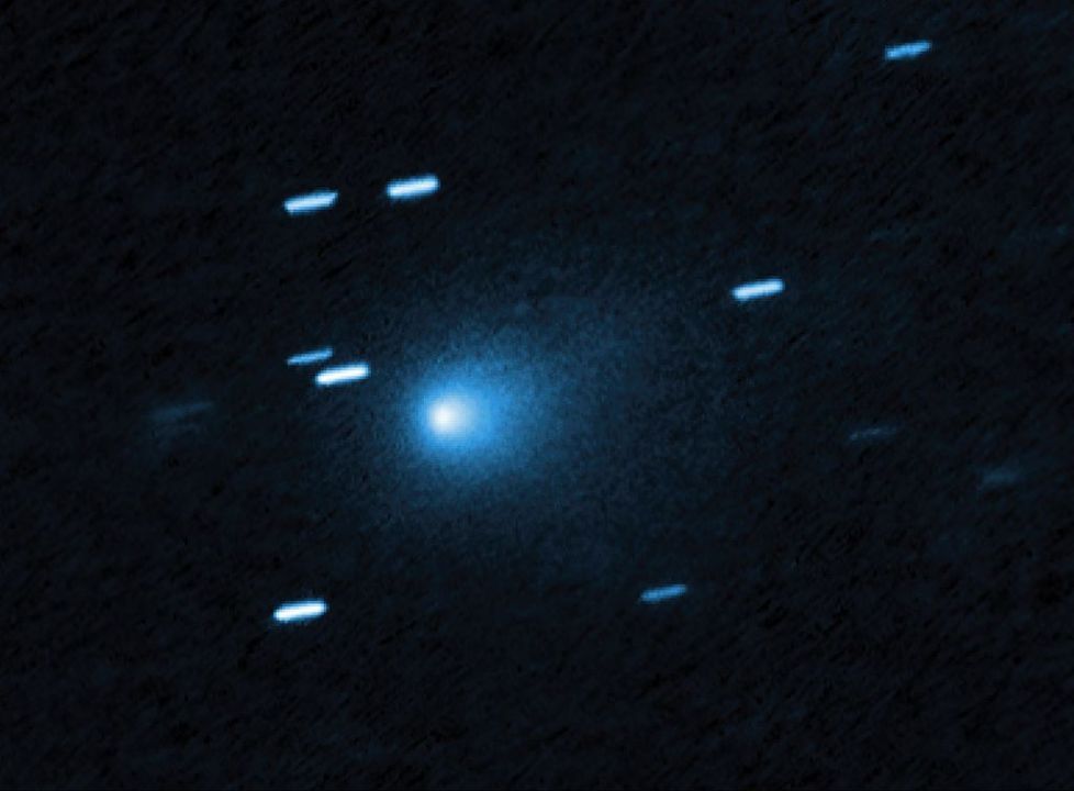 Big blue light surrounded by smaller dashes of light -- a visual image of comet 3I/ATLAS