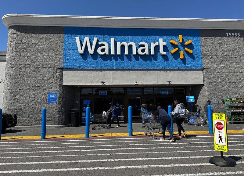 Customers enter a Walmart store on April 09, 2025 in San Leandro, California.
