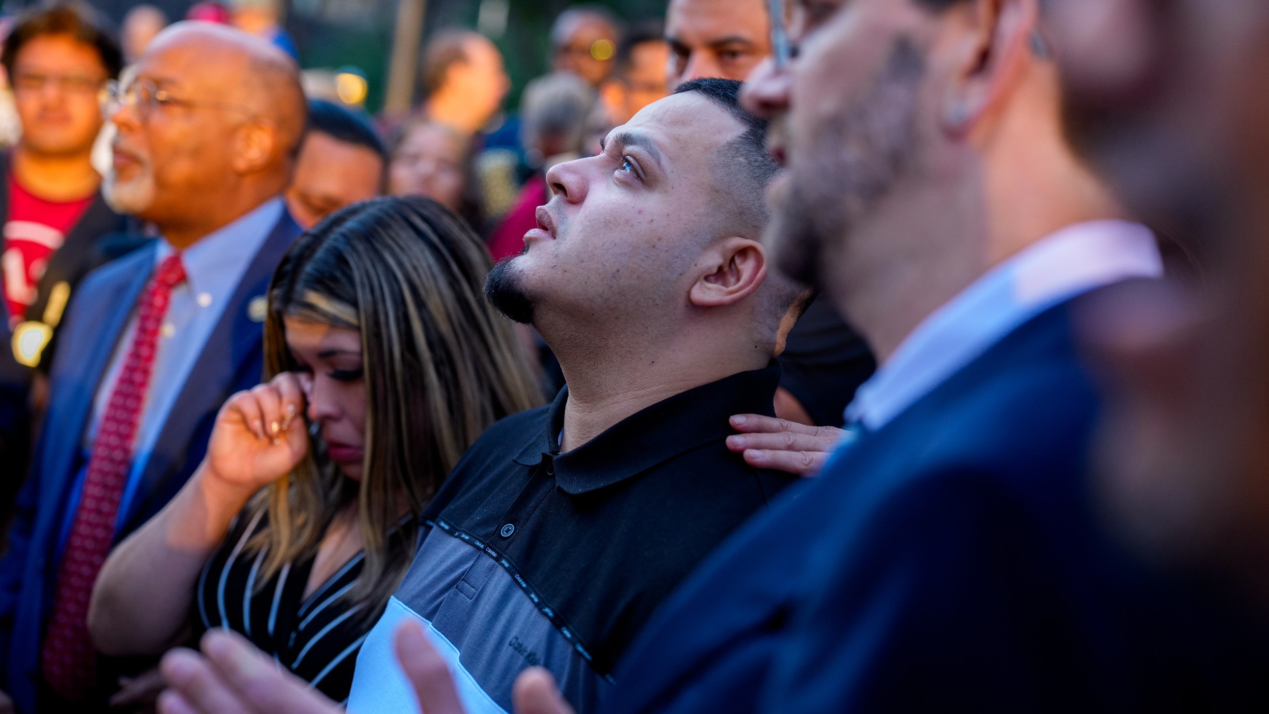 Kilmar Abrego GArcia looks up after a prayer vigil