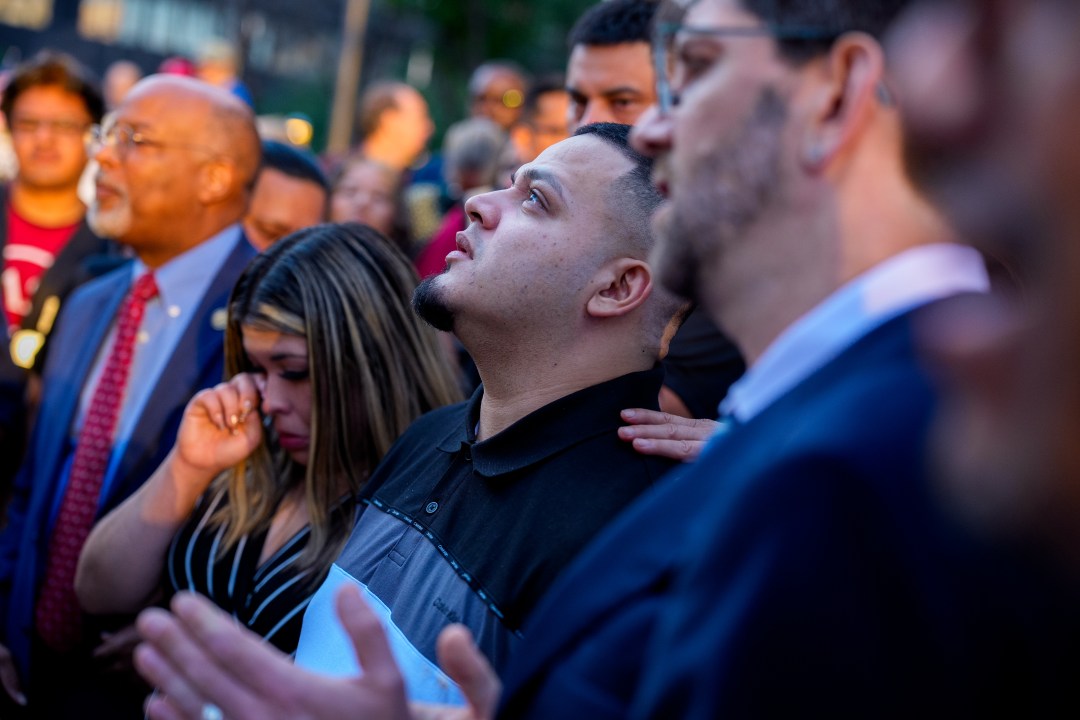 Kilmar Abrego GArcia looks up after a prayer vigil