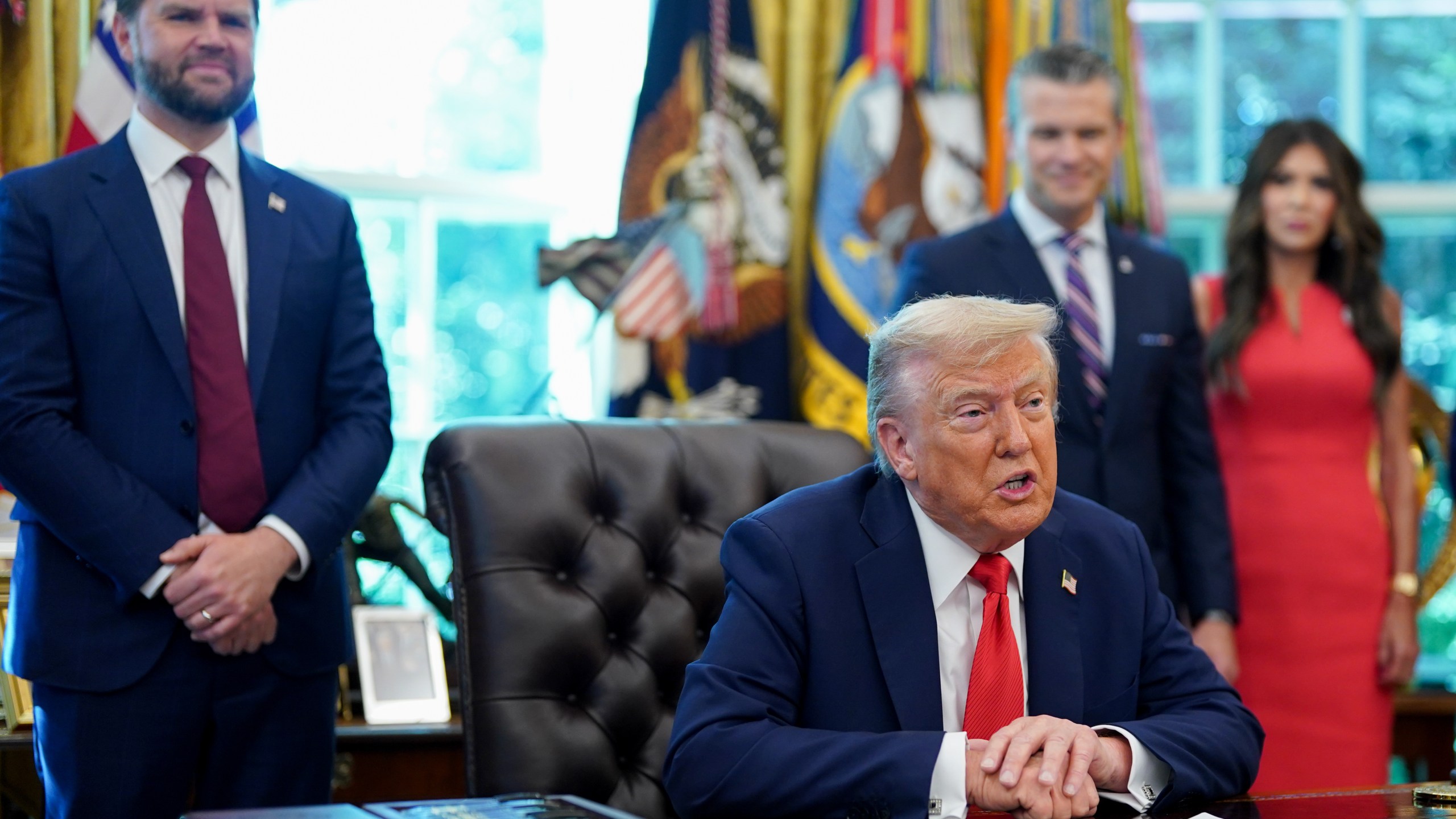 President Donald Trump speaks in the Oval Office