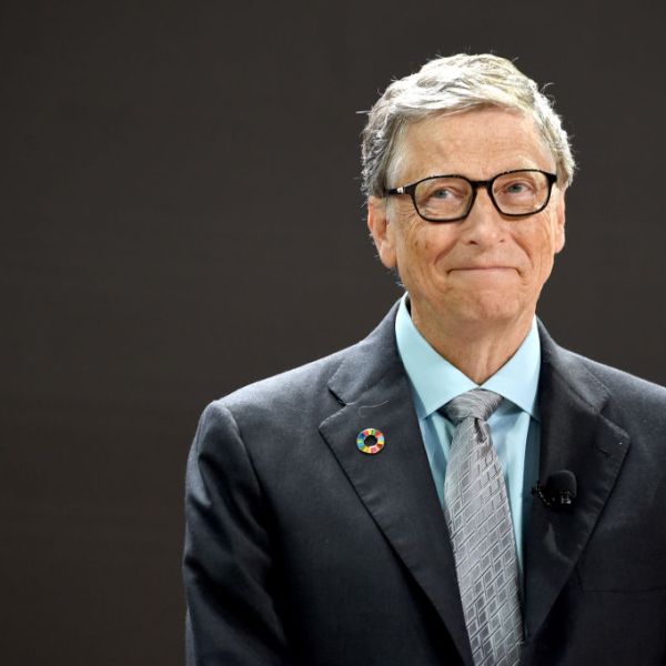 Bill Gates smiles while speaking at an event