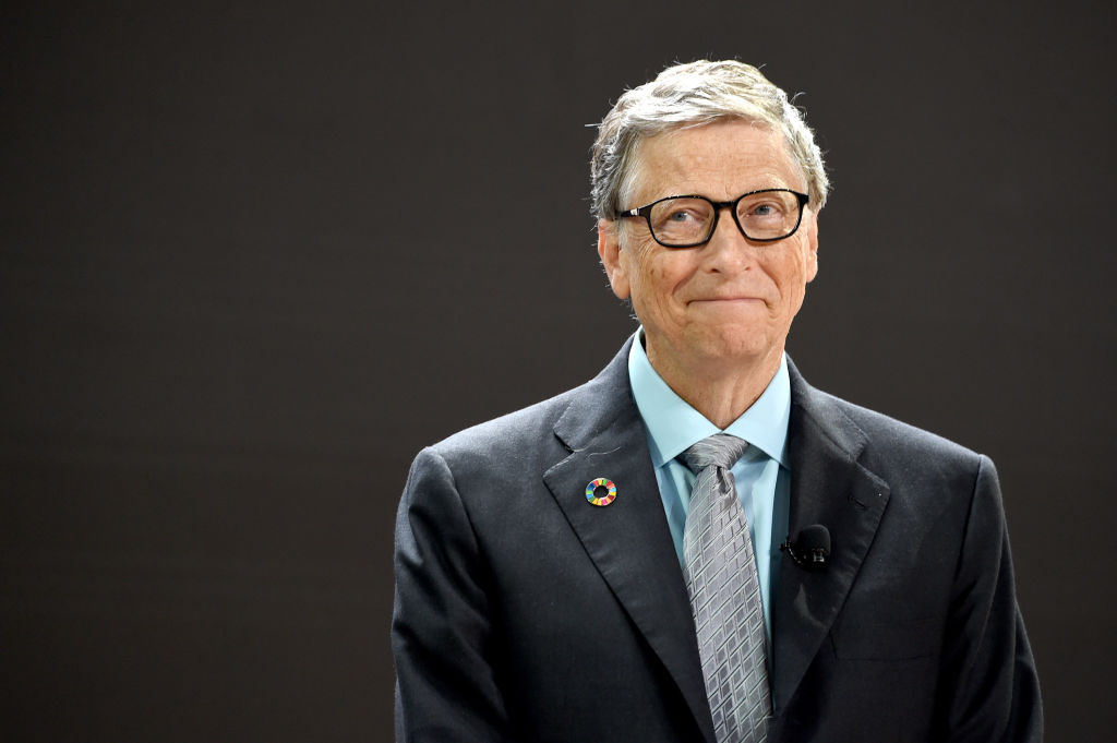 Bill Gates smiles while speaking at an event