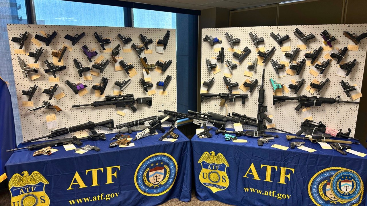 Weapons seized by ATF are displayed during press conference