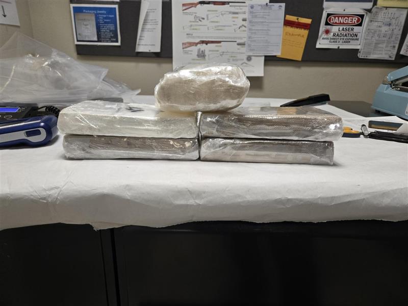 9.25 pounds of cocaine and 2.1 pounds of methamphetamine that were hidden inside the battery