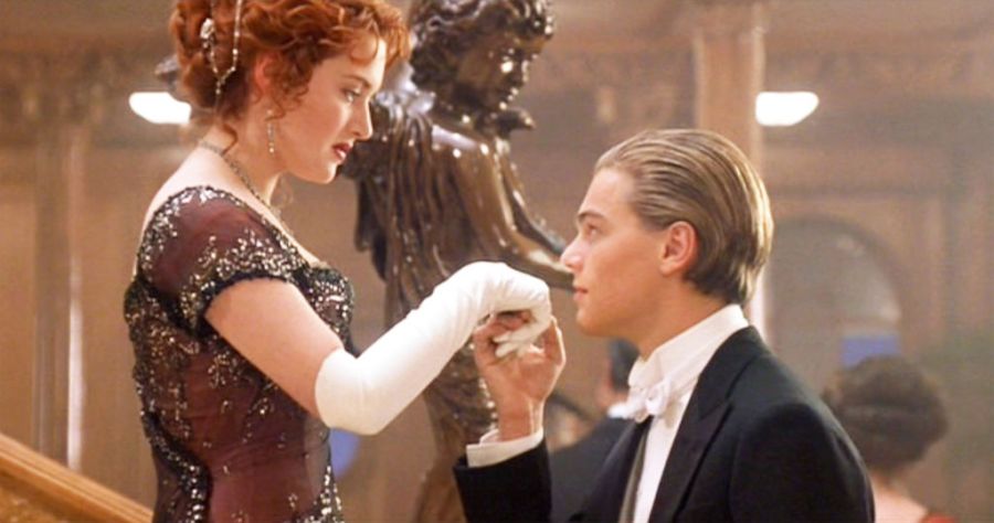 Still from Titanic of Jack kissing Rose's hand