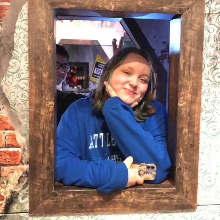 Kylee Monteiro poses while smiling for a photo