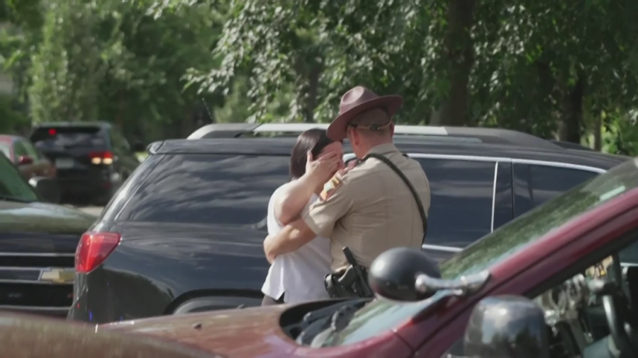 State trooper hugs upset woman