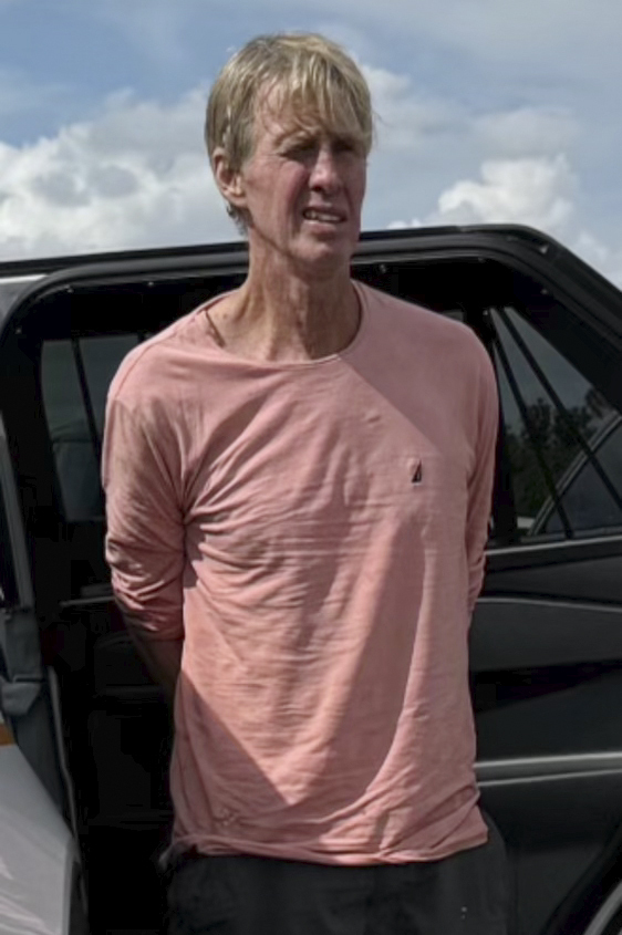 FILE - In this imaged released by the Martin County, Fla., Sheriff's Office, law enforcement officers arrest Ryan Routh, the man suspected in the apparent assassination attempt of Donald Trump, Sunday, Sept. 15, 2024. (Martin County Sheriff's Office via AP, File)