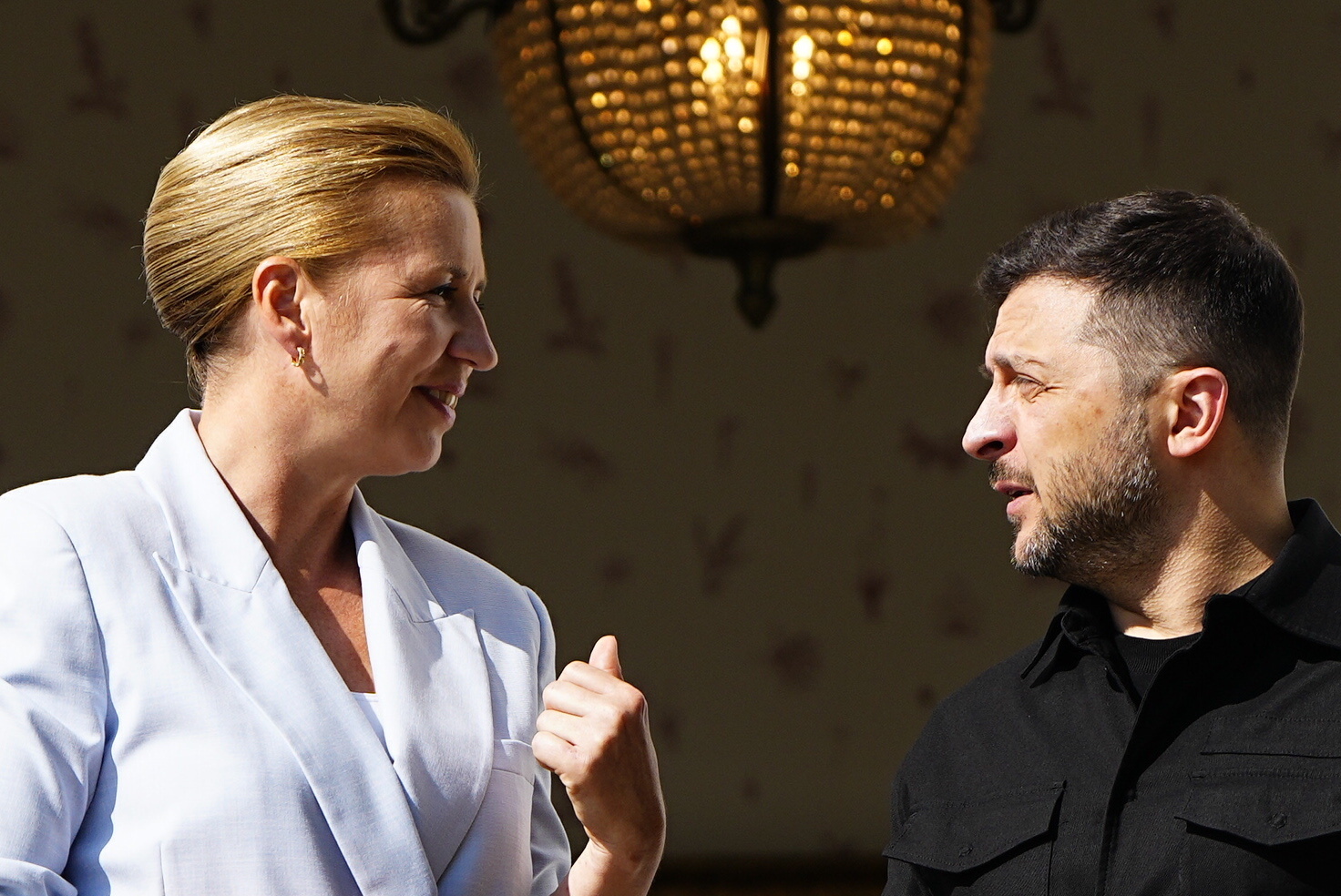 Danish Prime Minister Mette Frederiksen, left, welcomes Ukraine's President Volodymyr Zelenskyy, on the lawn in front of Marienborg, in Copenhagen, Wednesday, Sept. 3, 2025. (Mads Claus Rasmussen/Ritzau Scanpix via AP)