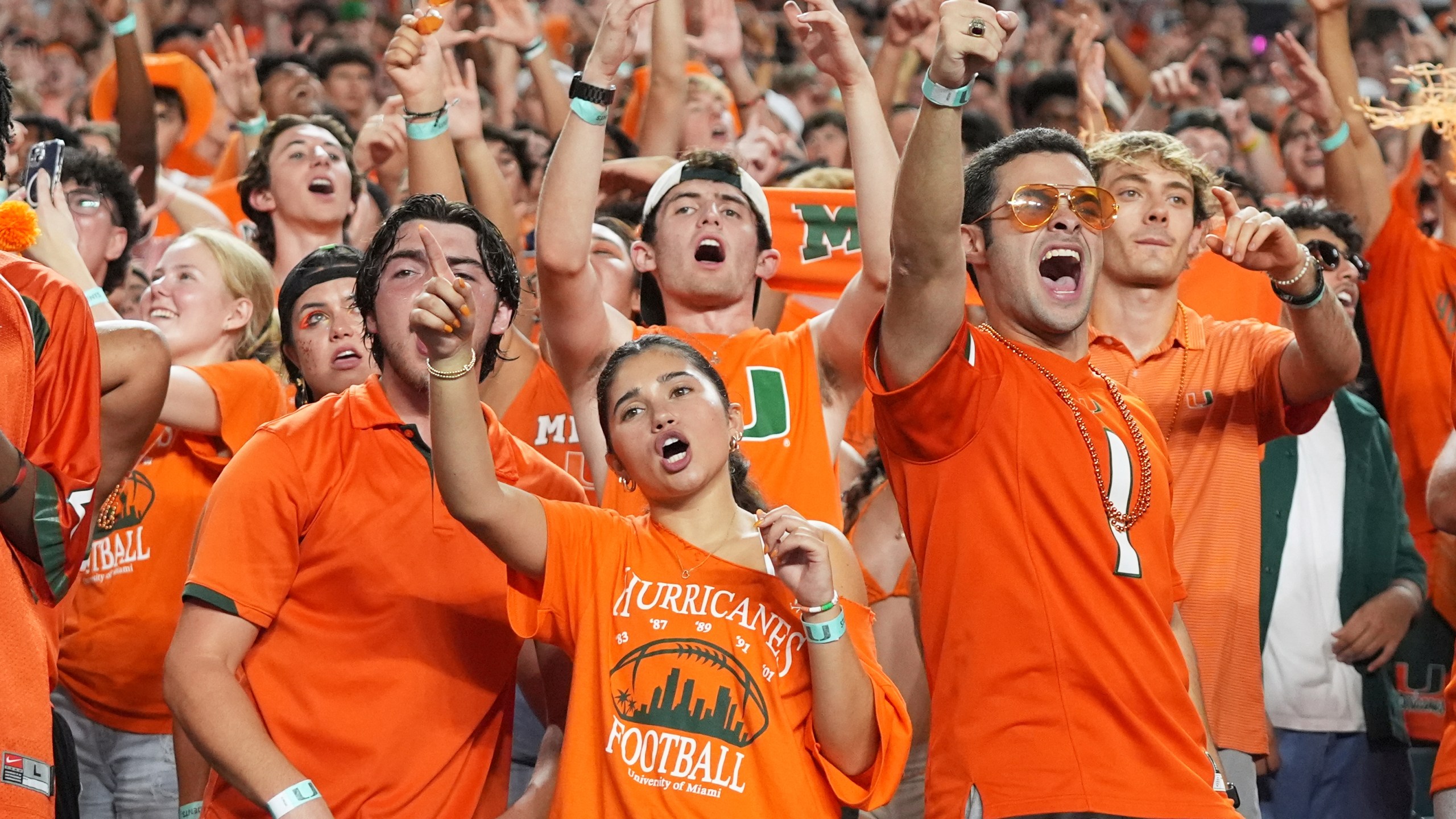 Miami fans cheer during the second half of an NCAA college football game against Notre Dame, Sunday, Aug. 31, 2025, in Miami Gardens, Fla. (AP Photo/Lynne Sladky)