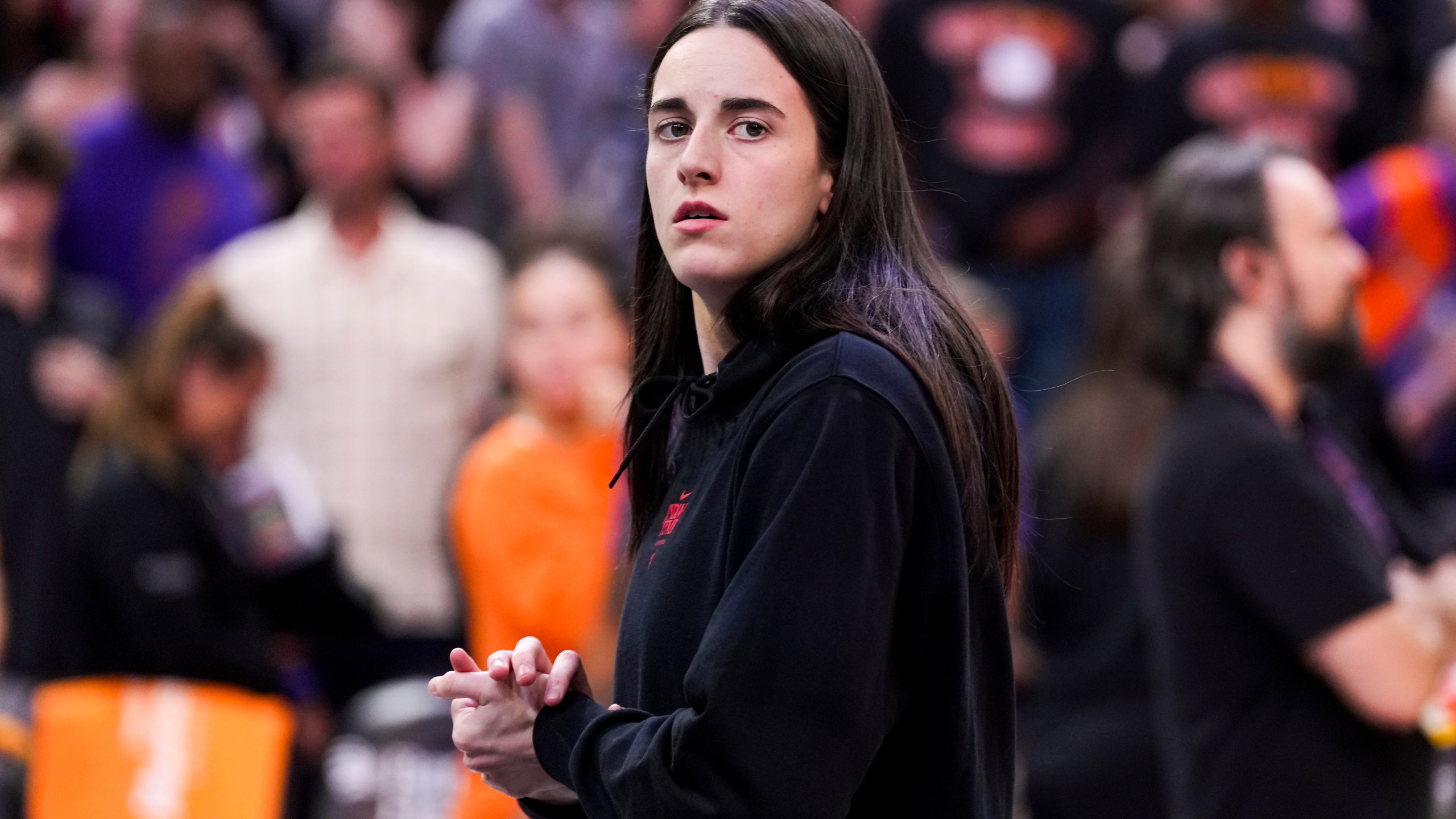 Indiana Fever guard Caitlin Clark walks off the court after a WNBA basketball game against the Phoenix Mercury, Tuesday, Sept. 2, 2025, in Phoenix. (AP Photo/Samantha Chow)