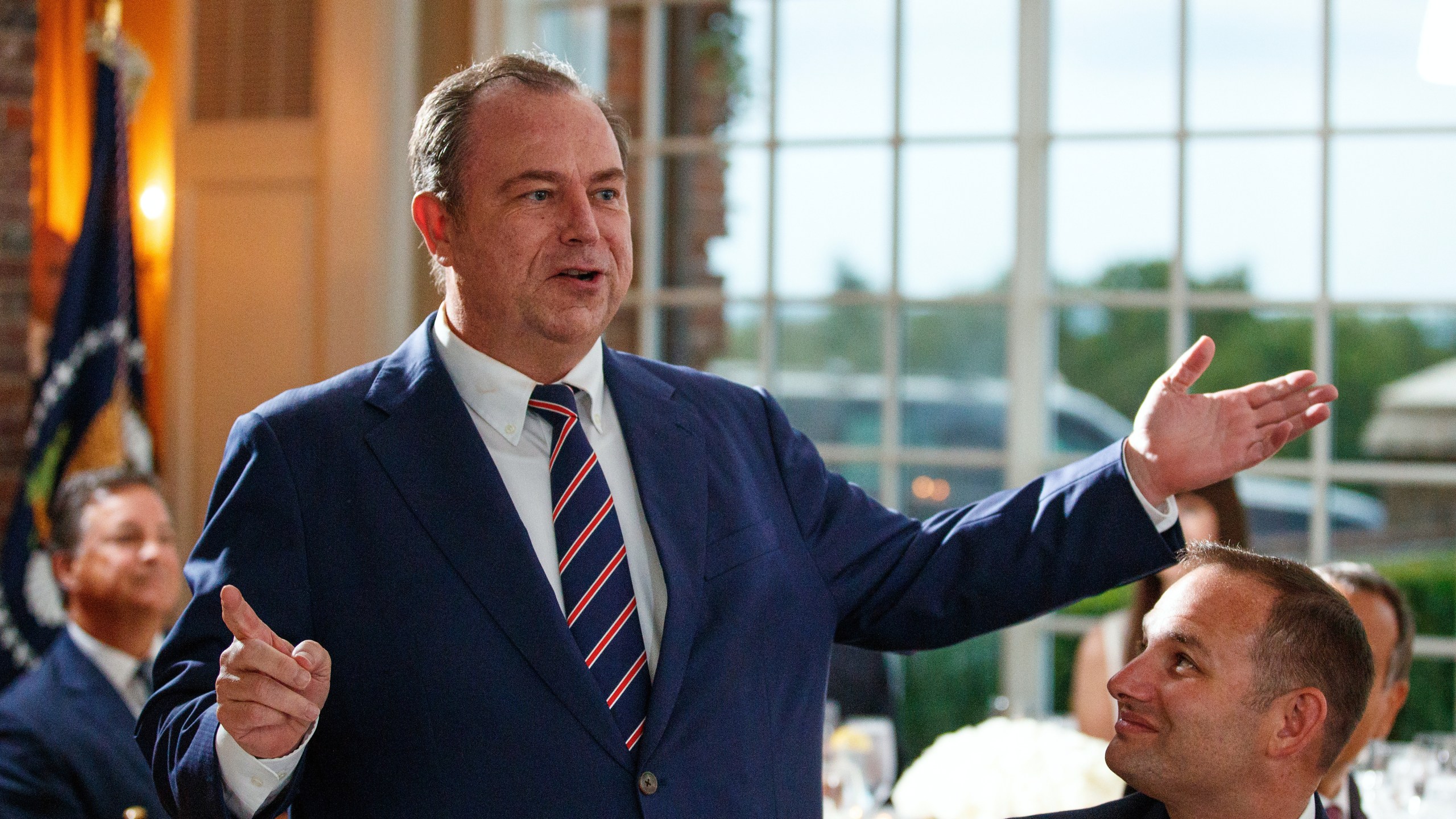FILE - Newsmax CEO Chris Ruddy speaks during a dinner meeting with President Donald Trump and other business leaders on Aug. 7, 2018, at Trump National Golf Club in Bedminster, N.J. (AP Photo/Carolyn Kaster, File)