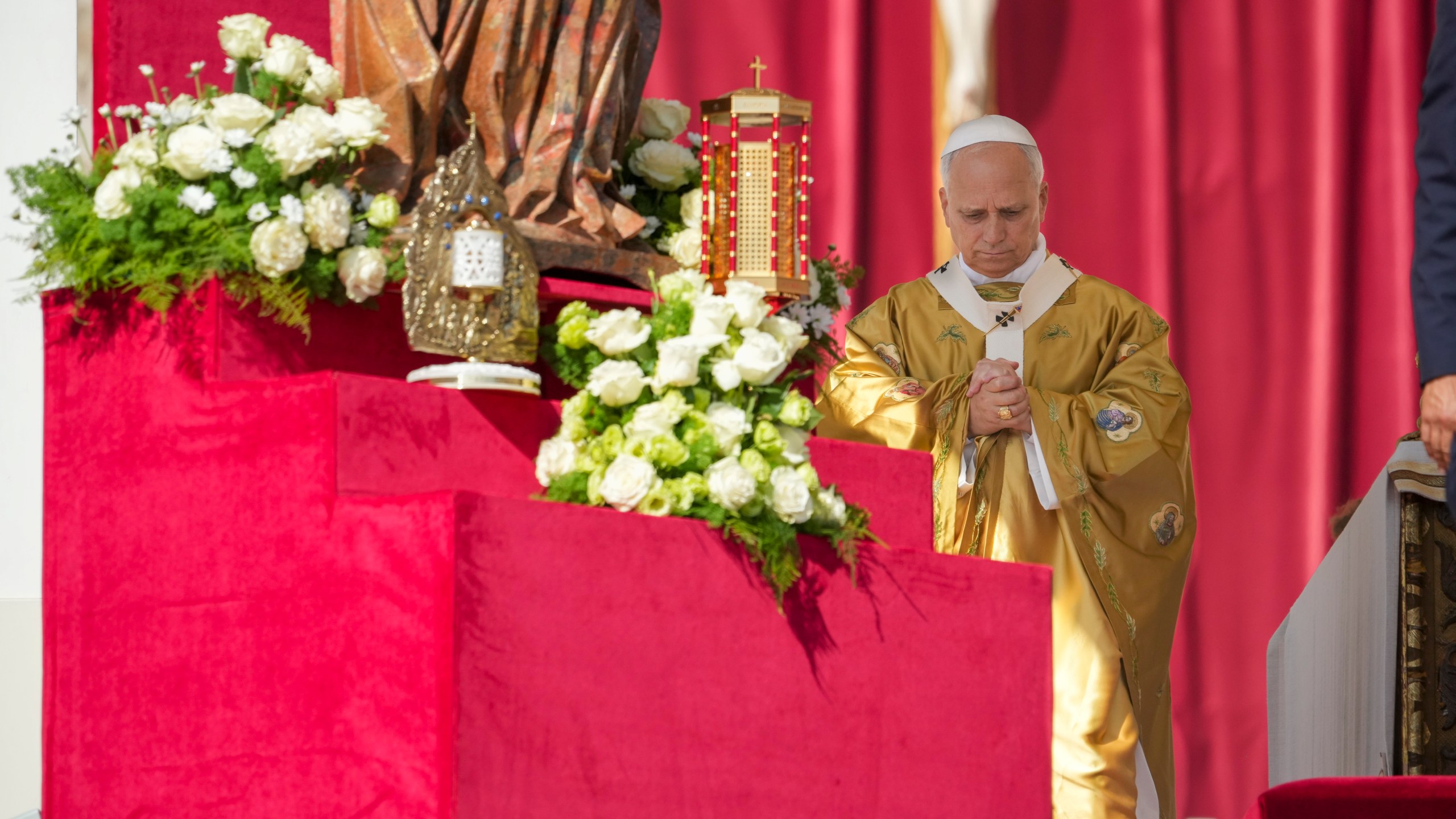 Relics of Carlo Acutis and Pier Giorgio Frassati, left, are displayed during their canonization Mass celebrated by Pope Leo XIV in St. Peter's Square at the Vatican Sunday, Sept. 7, 2025. (AP Photo/Andrew Medichini)