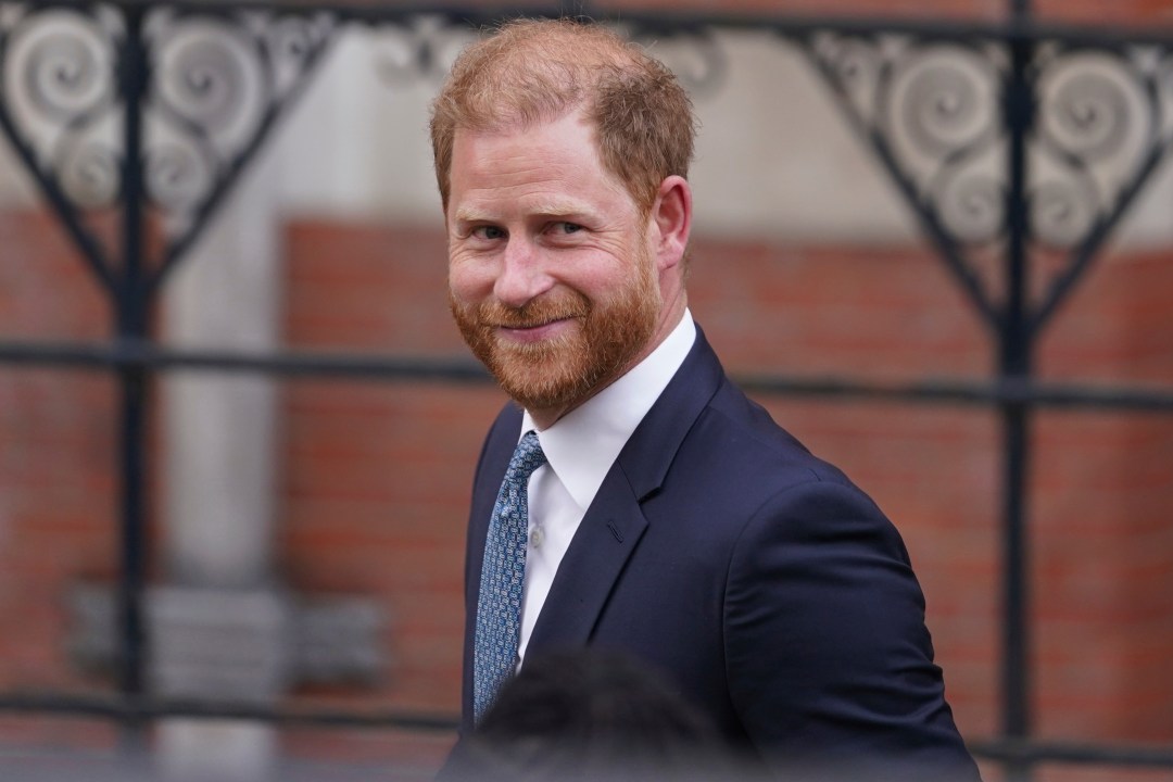 FILE - Britain's Prince Harry smiles towards the media as he leaves the Royal Courts of Justice in London, Tuesday, April 8, 2025. (AP Photo/Alberto Pezzali, File)