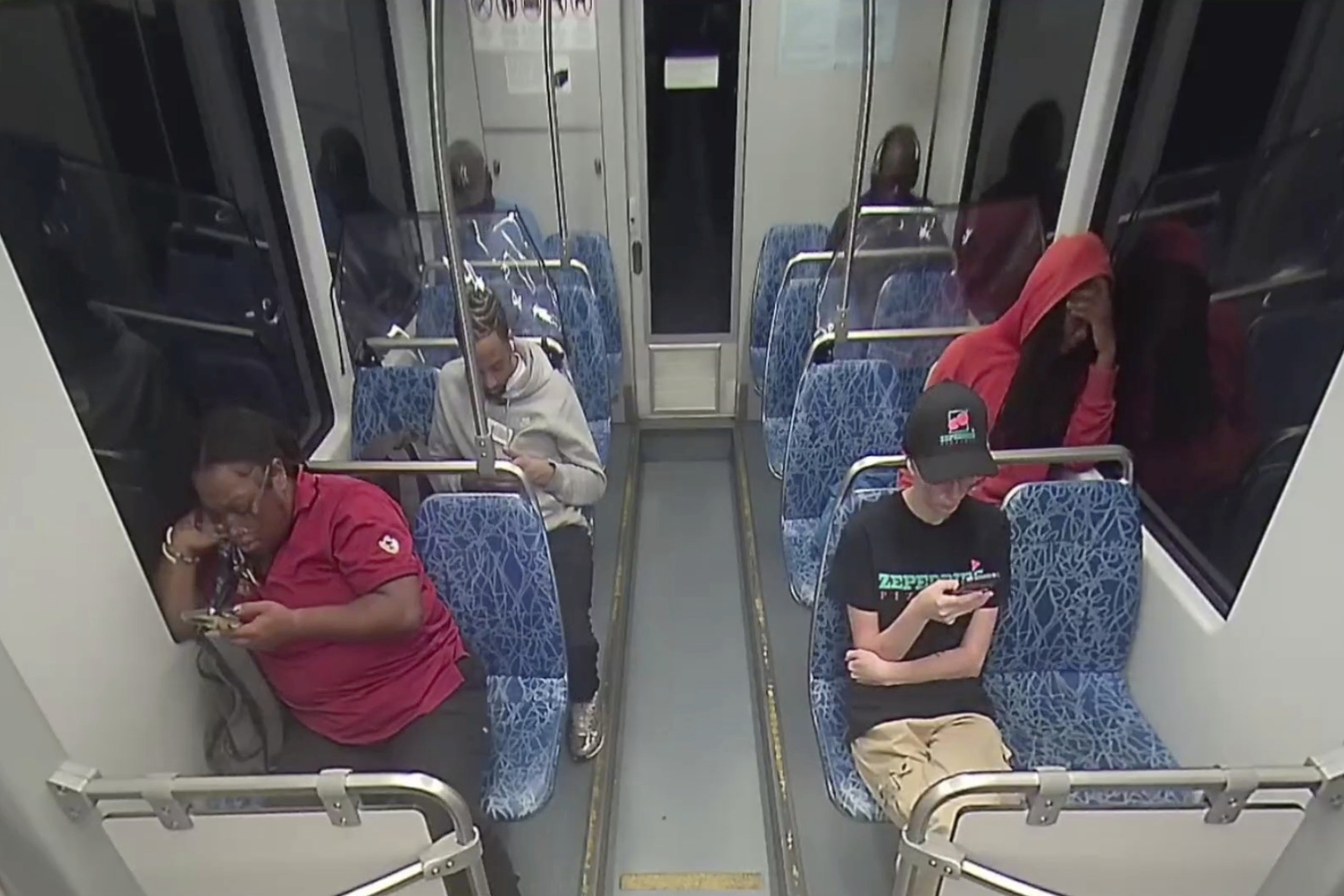 This screengrab made from video provided by the Charlotte Area Transit System shows Iryna Zarutska, bottom right, before she was fatally stabbed on a commuter train on Aug. 22, 2025. (Charlotte Area Transit System via AP)