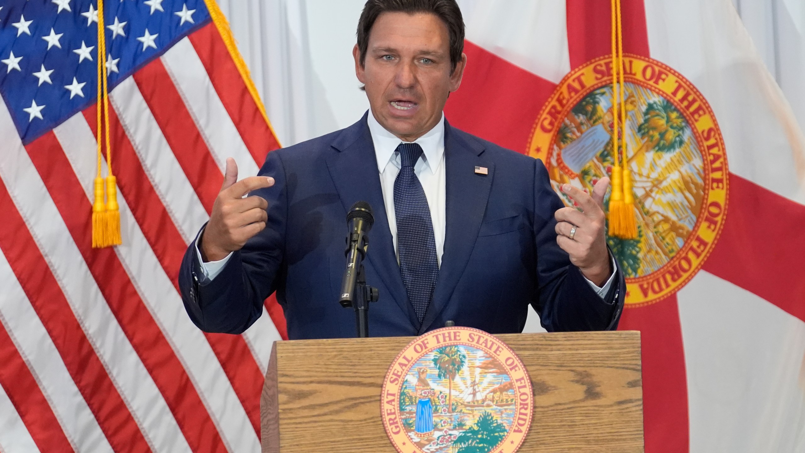Florida Gov. Ron DeSantis speaks from a podium