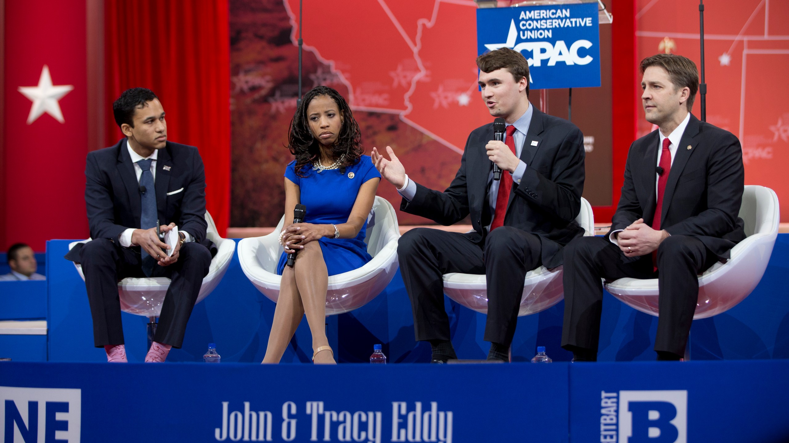 FILE - From left, Republican National Committee deputy press secretary Raffi Williams, Rep. Mia Love, R-Utah, Charlie Kirk, Turning Point USA, and Sen. Ben Sasse R-Neb., participate in a panel discussion in National Harbor, Md., Feb. 26, 2015. (AP Photo/Carolyn Kaster, File)