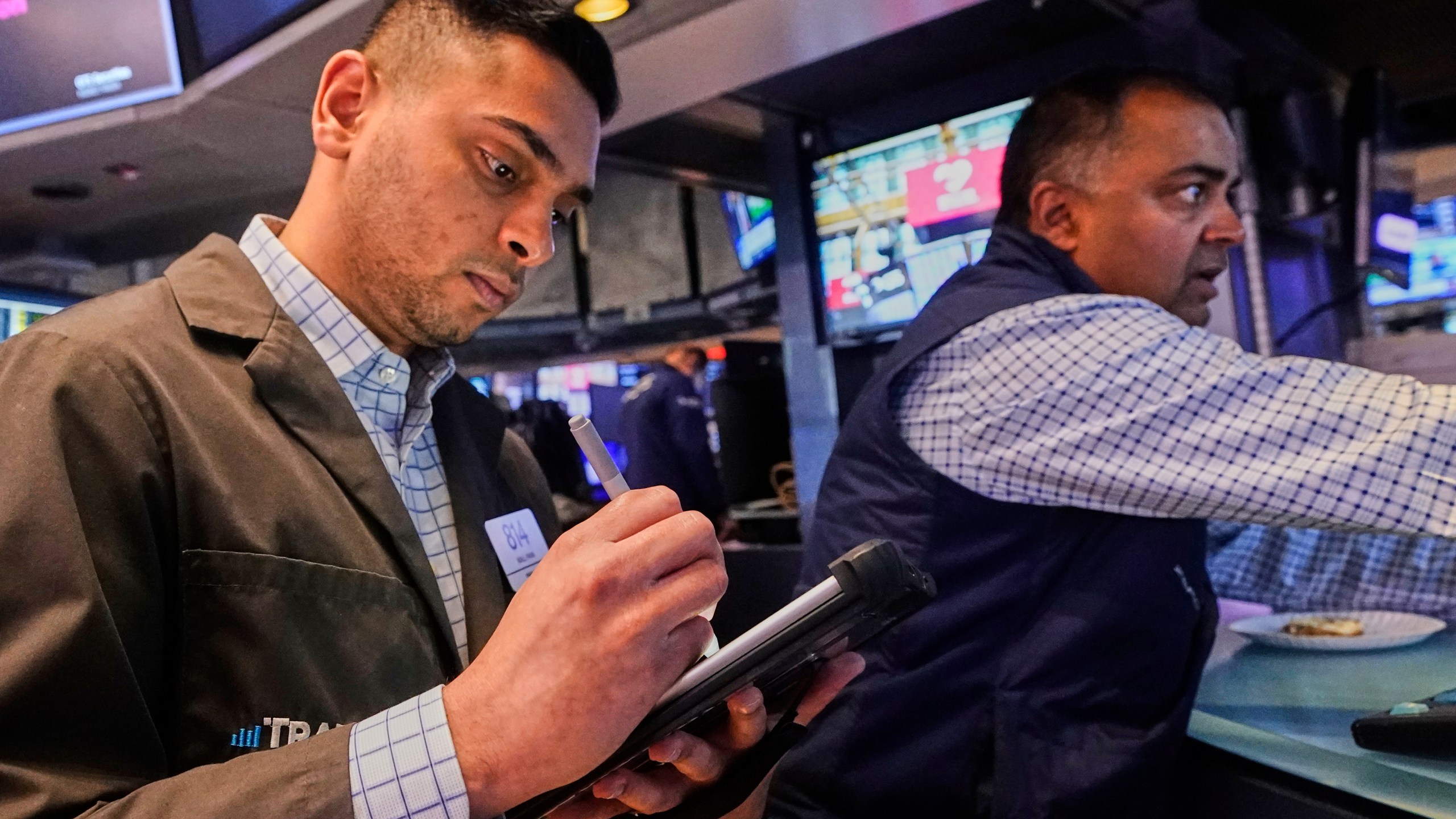 Trader Niall Pawa, left, and specialist Dilip Patel work on the floor of the New York Stock Exchange, Wednesday, Sept. 10, 2025. (AP Photo/Richard Drew)