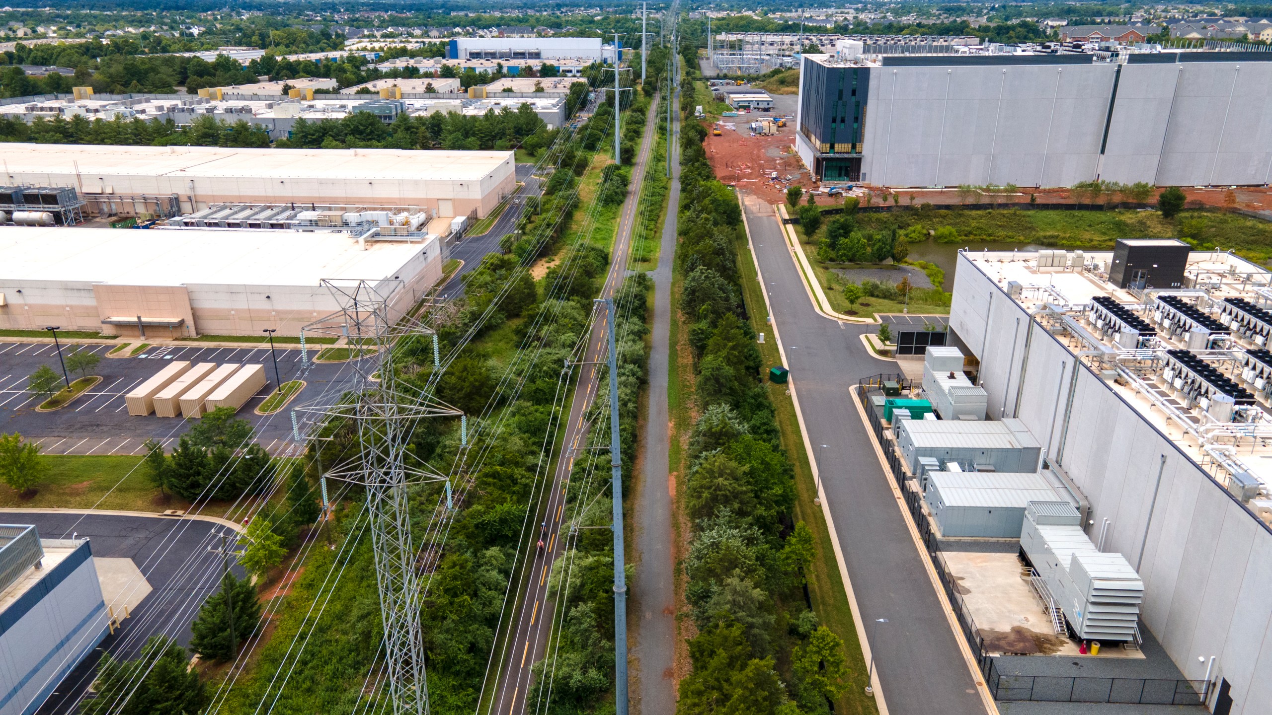 FILE - High-voltage transmission lines provide electricity to data centers in Ashburn in Loudon County, Virginia, on Sunday, July 16, 2023. (AP Photo/Ted Shaffrey, File)