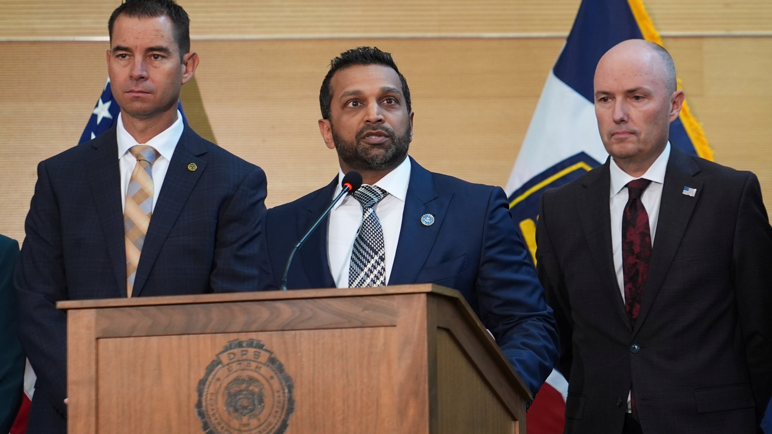 Kash Patel speaks at a news conference, Friday, Sept. 12, 2025, in Orem, Utah, as Utah department of public safety commissioner Beau Mason, left, and Utah Gov. Spencer Cox listen. (AP Photo/Lindsey Wasson)