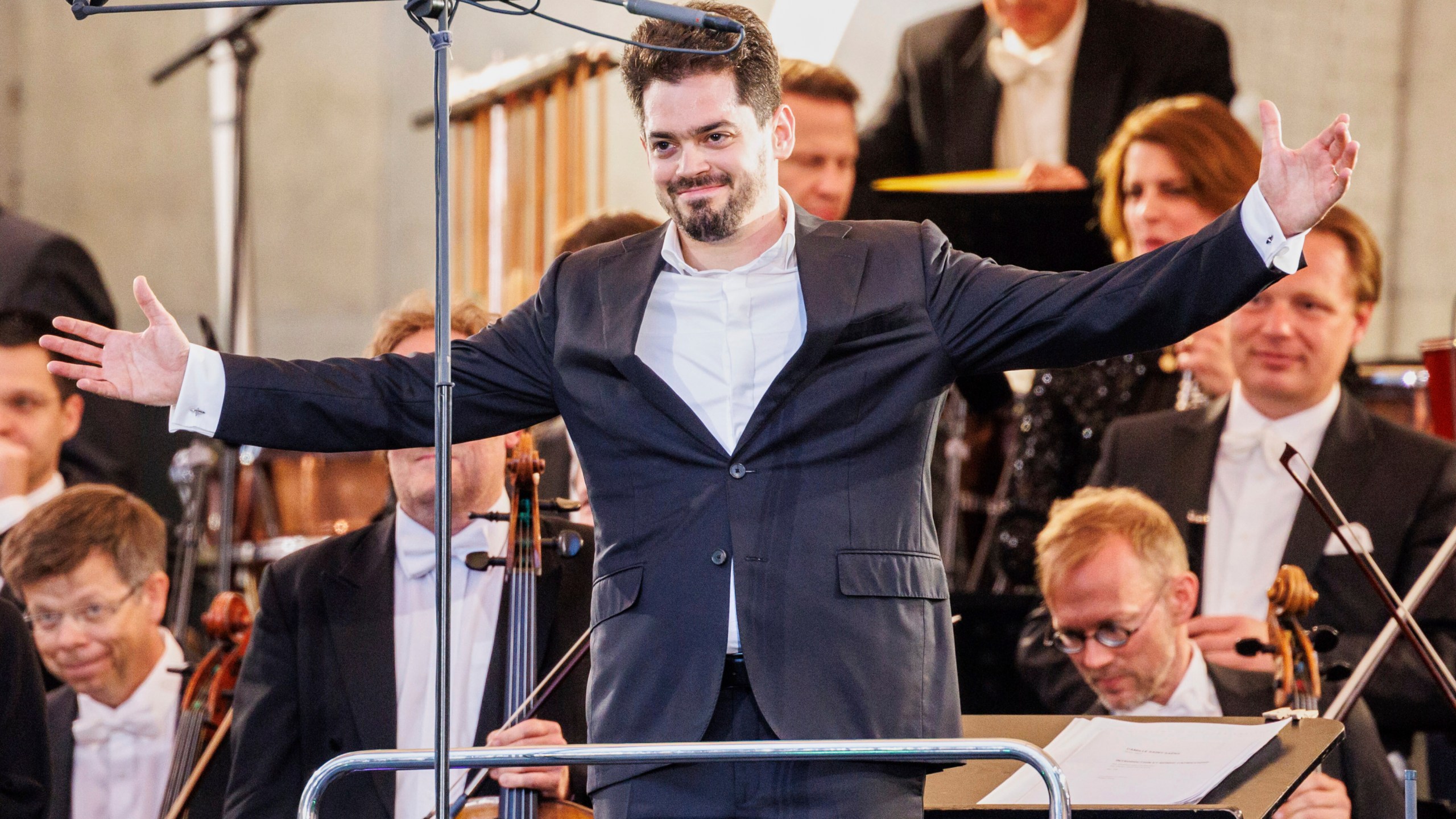 Israeli conductor Lahav Shani is onstage at the Munich Philharmonic's 'Klassik am Odeonsplatz' concert, in Munich, Germany, July 13, 2024. (Matthias Balk/dpa via AP)