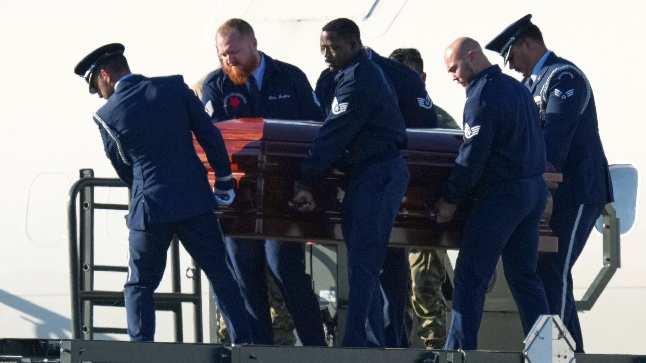 The casket containing the body of Charlie Kirk, the CEO and co-founder of Turning Point USA who was shot and killed on Wednesday is removed from Air Force Two at Phoenix Sky Harbor International Airport, Thursday, Sept. 11, 2025, in Phoenix. (AP Photo/Ross D. Franklin)