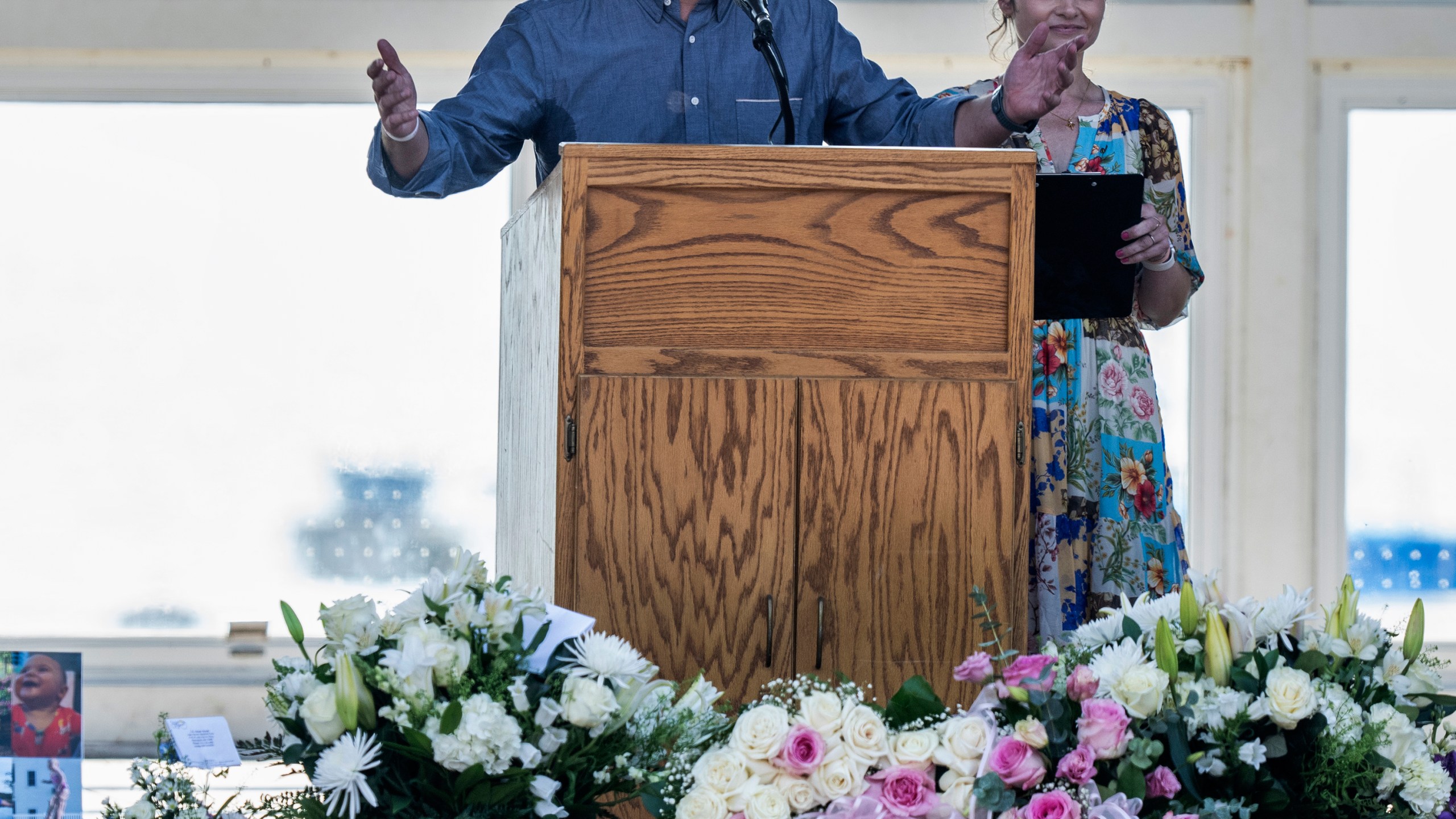 Parents Mike Moyski and Jackie Flavin thank the attendees who gathered for the celebration of life for Harper Moyski, who was killed in the Annunciation Catholic School church shooting, at the Lake Harriet Bandshell in Minneapolis, Minn., on Sunday, Sept. 14, 2025. (Richard Tsong-Taatarii/Star Tribune via AP)