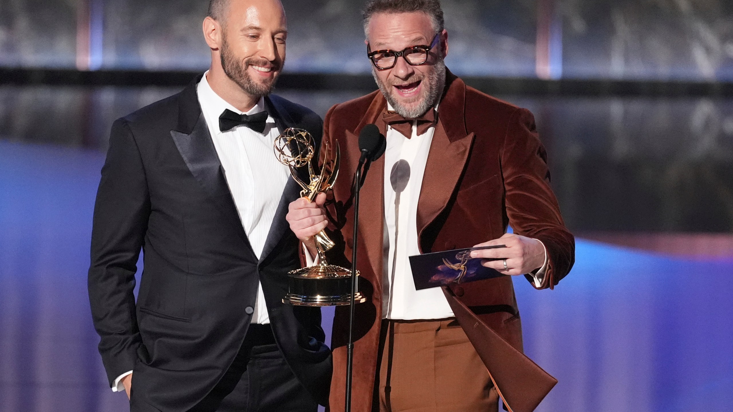 Evan Goldberg, left, and Seth Rogen accept the award for outstanding directing for a comedy series for "The Studio" during the 77th Primetime Emmy Awards on Sunday, Sept. 14, 2025, at the Peacock Theater in Los Angeles. (AP Photo/Chris Pizzello)