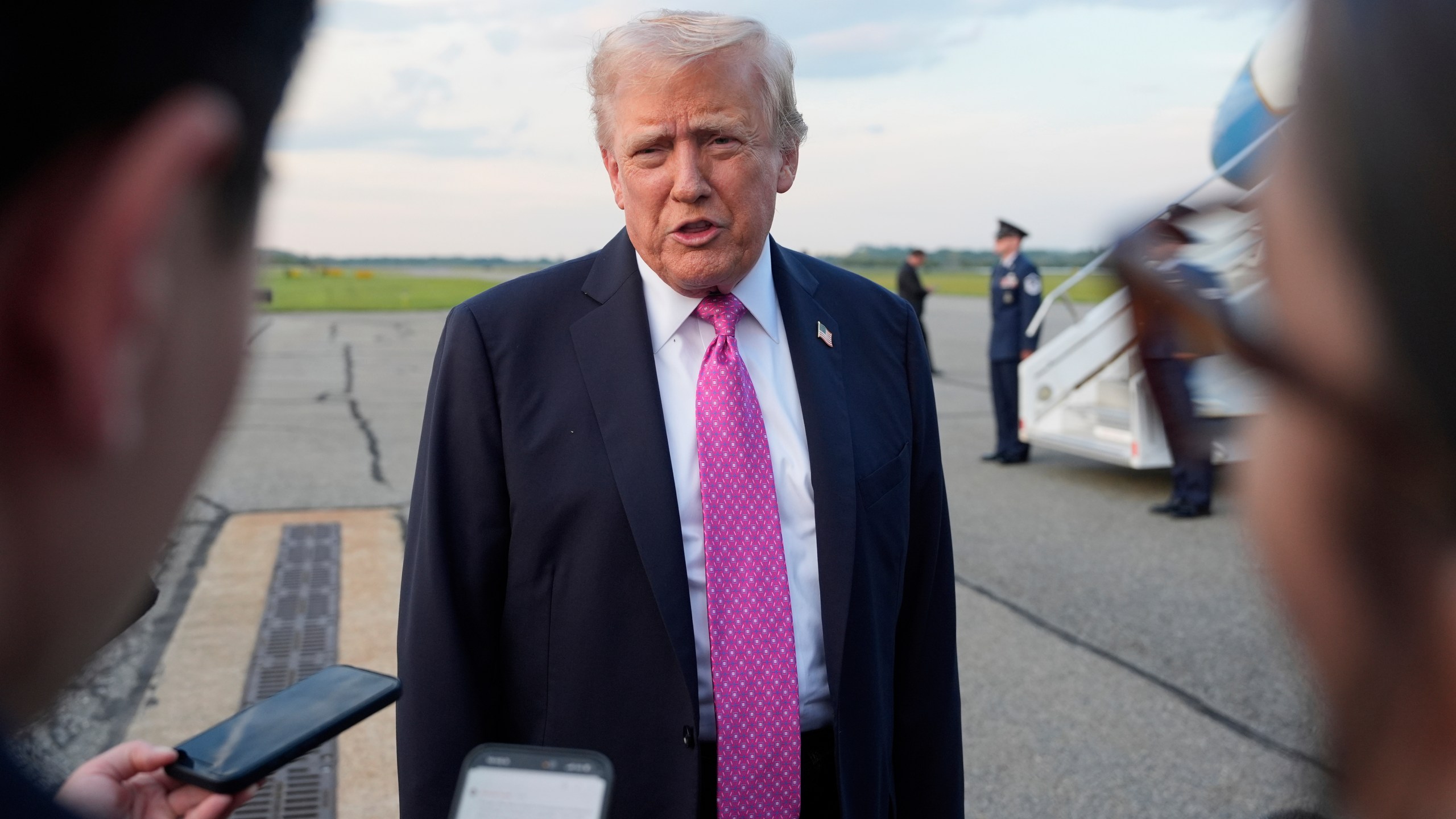 President Donald Trump speaks with reporters before boarding Air Force One at Morristown Airport, Sunday, Sept. 14, 2025, in Morristown, N.J. (AP Photo/Alex Brandon)