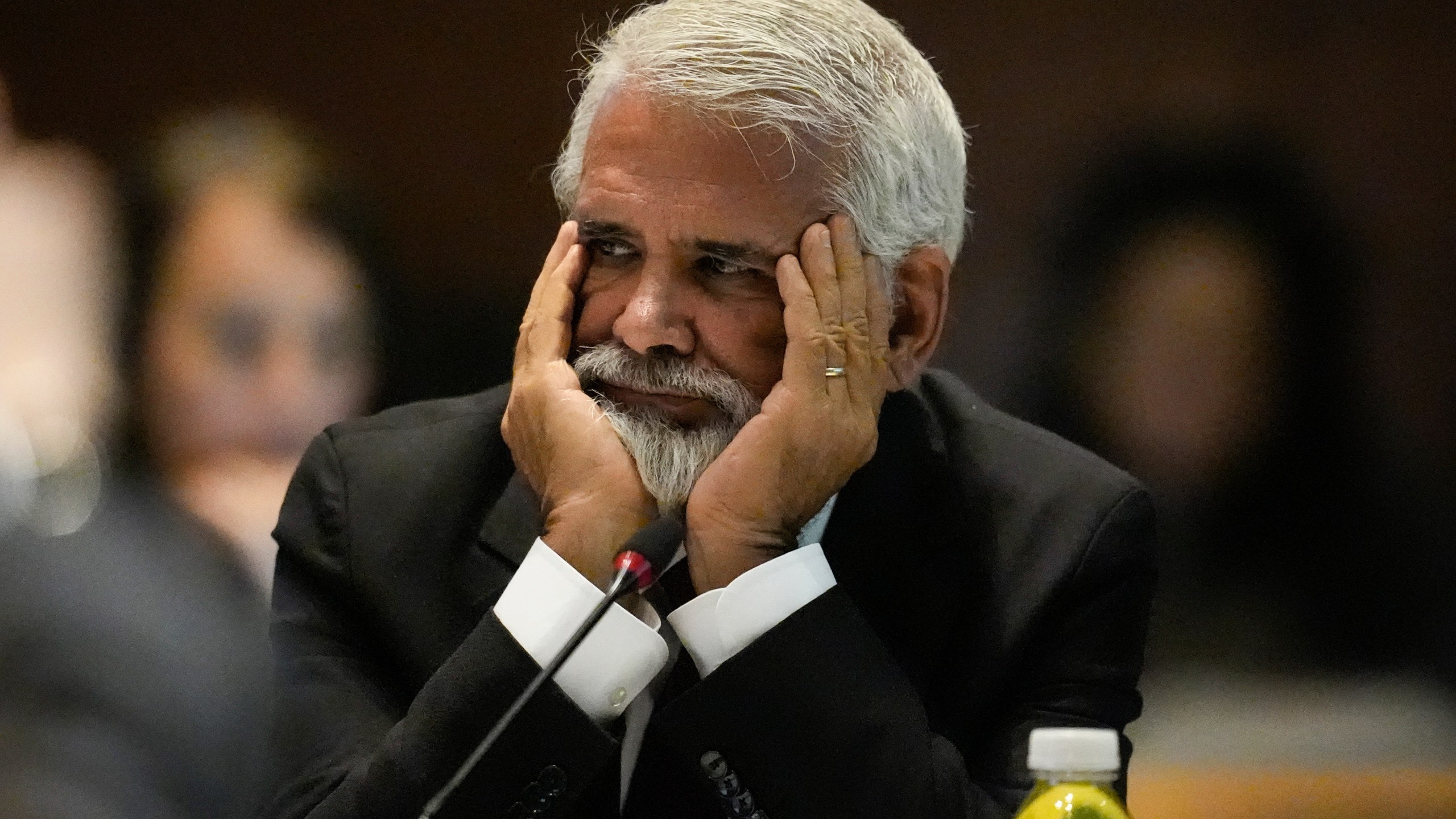 FILE - Dr. Robert Malone listens during a meeting of the Advisory Committee on Immunization Practices at the CDC, June 25, 2025, in Atlanta. (AP Photo/Mike Stewart, File)