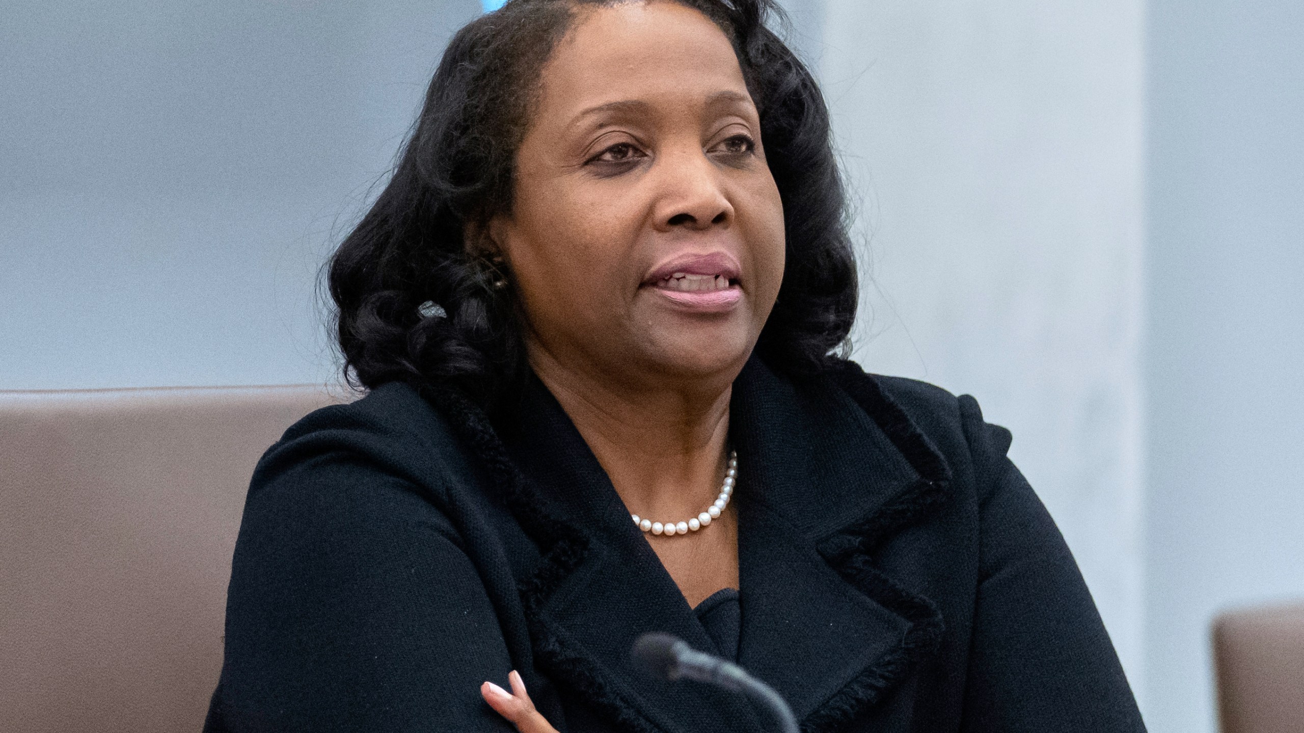 FILE - Federal Reserve Board of Governors member Lisa Cook listens during an open meeting of the Board of Governors at the Federal Reserve, June 25, 2025, in Washington. (AP Photo/Mark Schiefelbein, File)