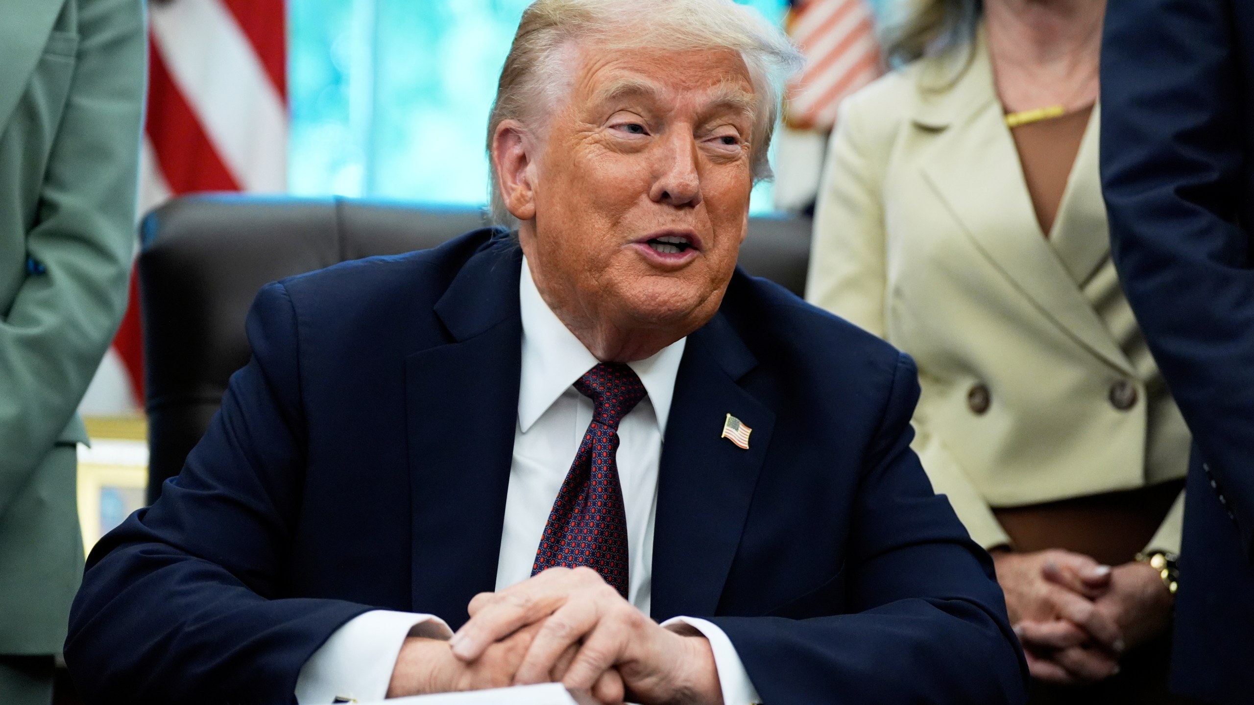 President Donald Trump speaks in the Oval Office