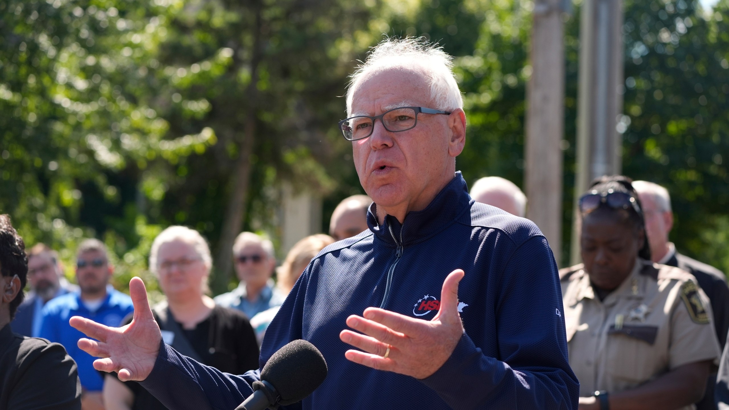 Minnesota Gov. Tim Walz speaks outside the Annunciation Catholic School following a shooting Wednesday, Aug. 27, 2025, in Minneapolis. (AP Photo/Bruce Kluckhohn)