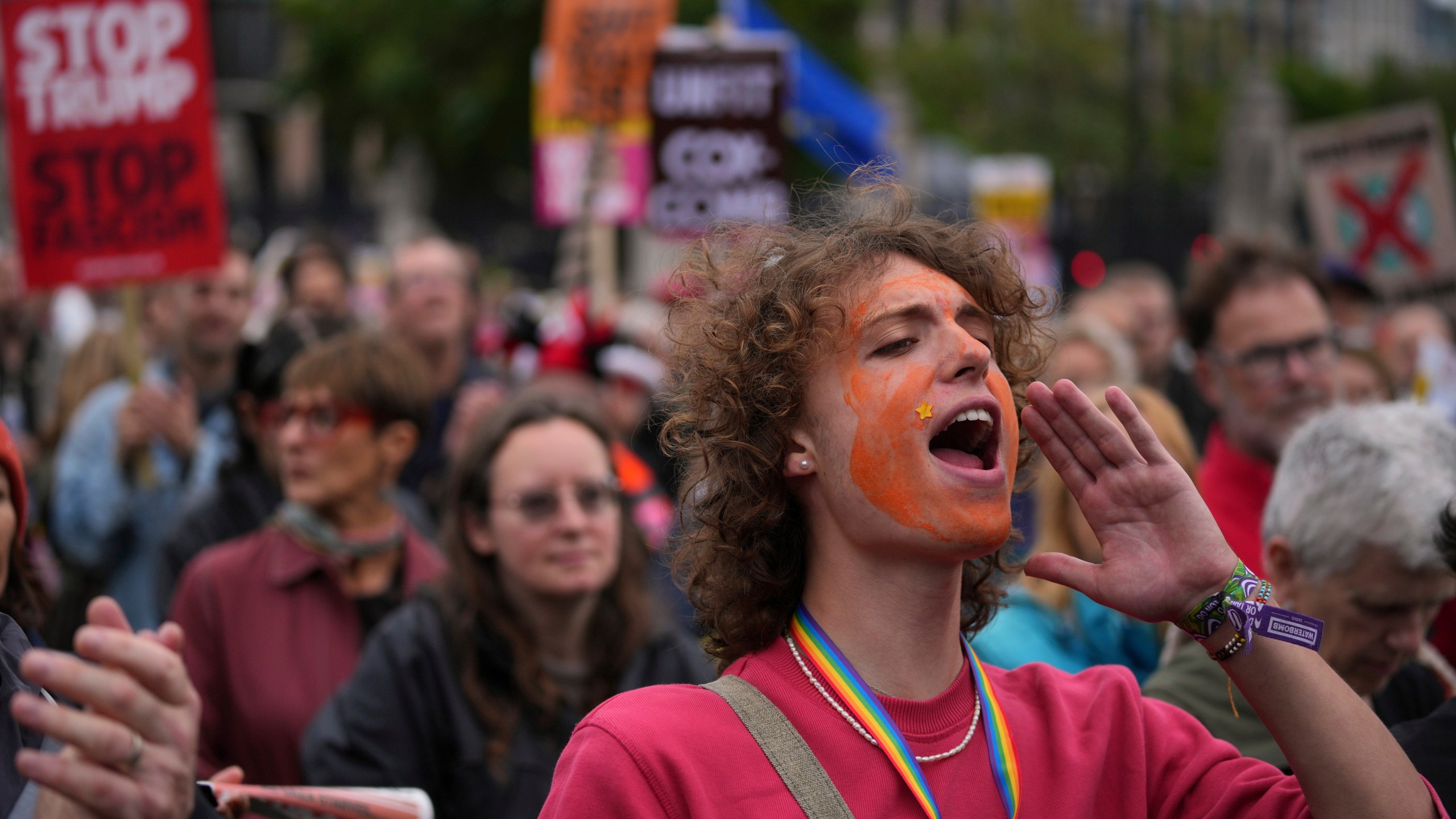 Stop Trump Coalition campaigners take part in a protest march against President Donald Trump's state visit in London, Wednesday, Sept. 17, 2025.(AP Photo/Kin Cheung)