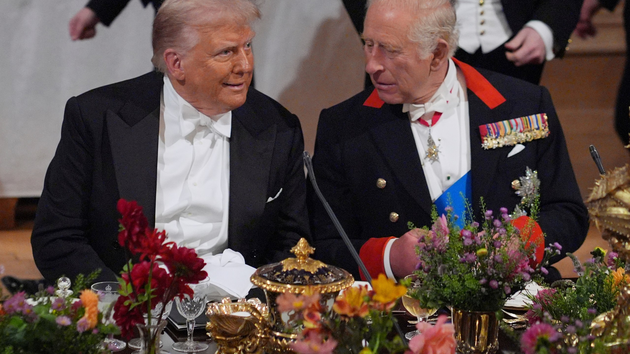 Britain's King Charles, right, and U.S. President Donald Trump speak at a State Banquet in Windsor Castle, England, on day one of U.S. President Donald Trump and First Lady Melania Trump's second state visit to the UK, Wednesday Sept. 17, 2025. (Yui Mok/PA via AP, Pool Photo via AP)