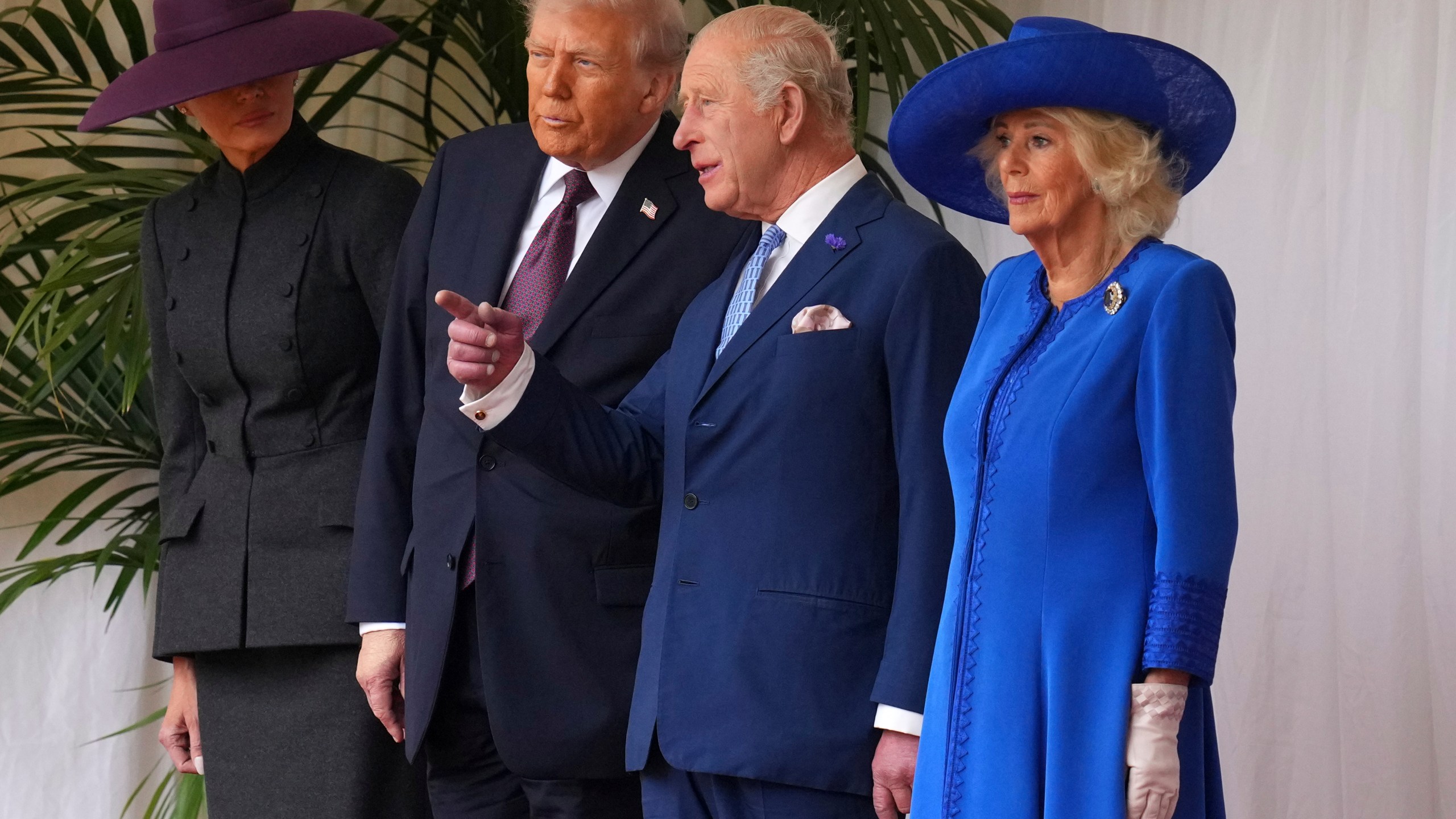 President Donald Trump, Britain's King Charles III, Queen Camilla and Melania Trump on the left wait to review the Guard of Honour at Windsor Castle in Windsor, England, Wednesday, Sept. 17, 2025.(AP Photo/Kirsty Wigglesworth, Pool)