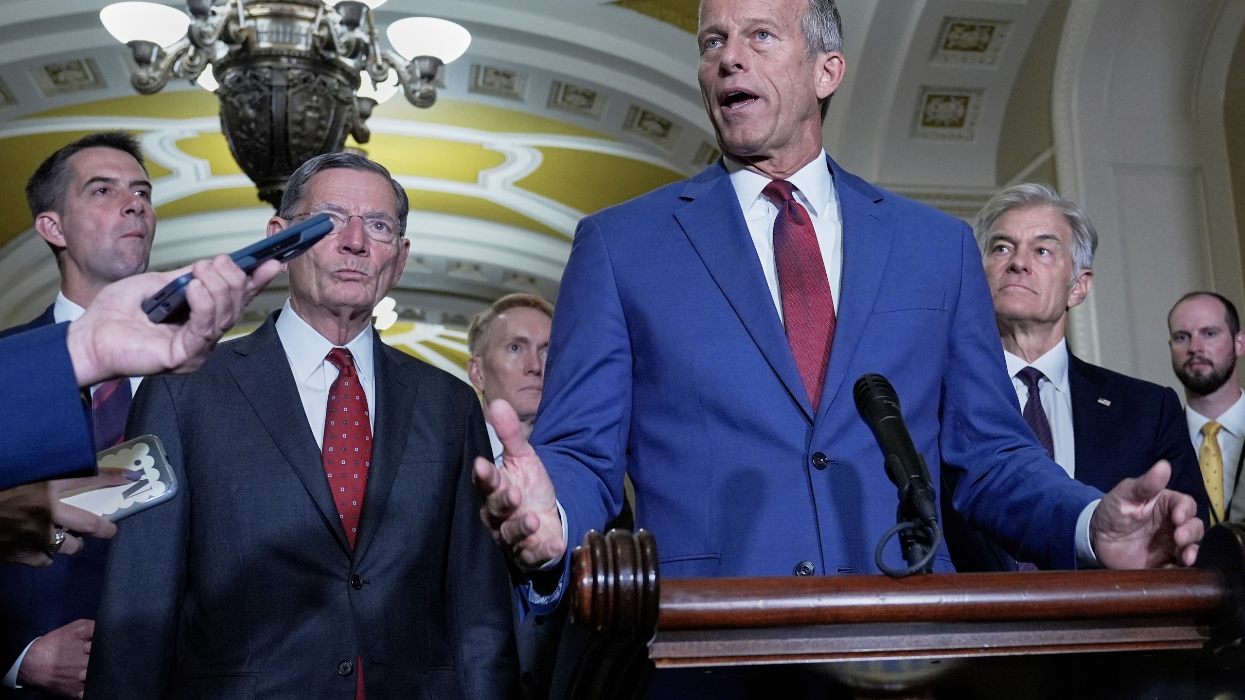 Sen. Majority Leader John Thune, R-S.D., center, speaks during a news conference after a policy luncheon at the Capitol, Tuesday, Sept. 16, 2025, in Washington. (AP Photo/Mariam Zuhaib)