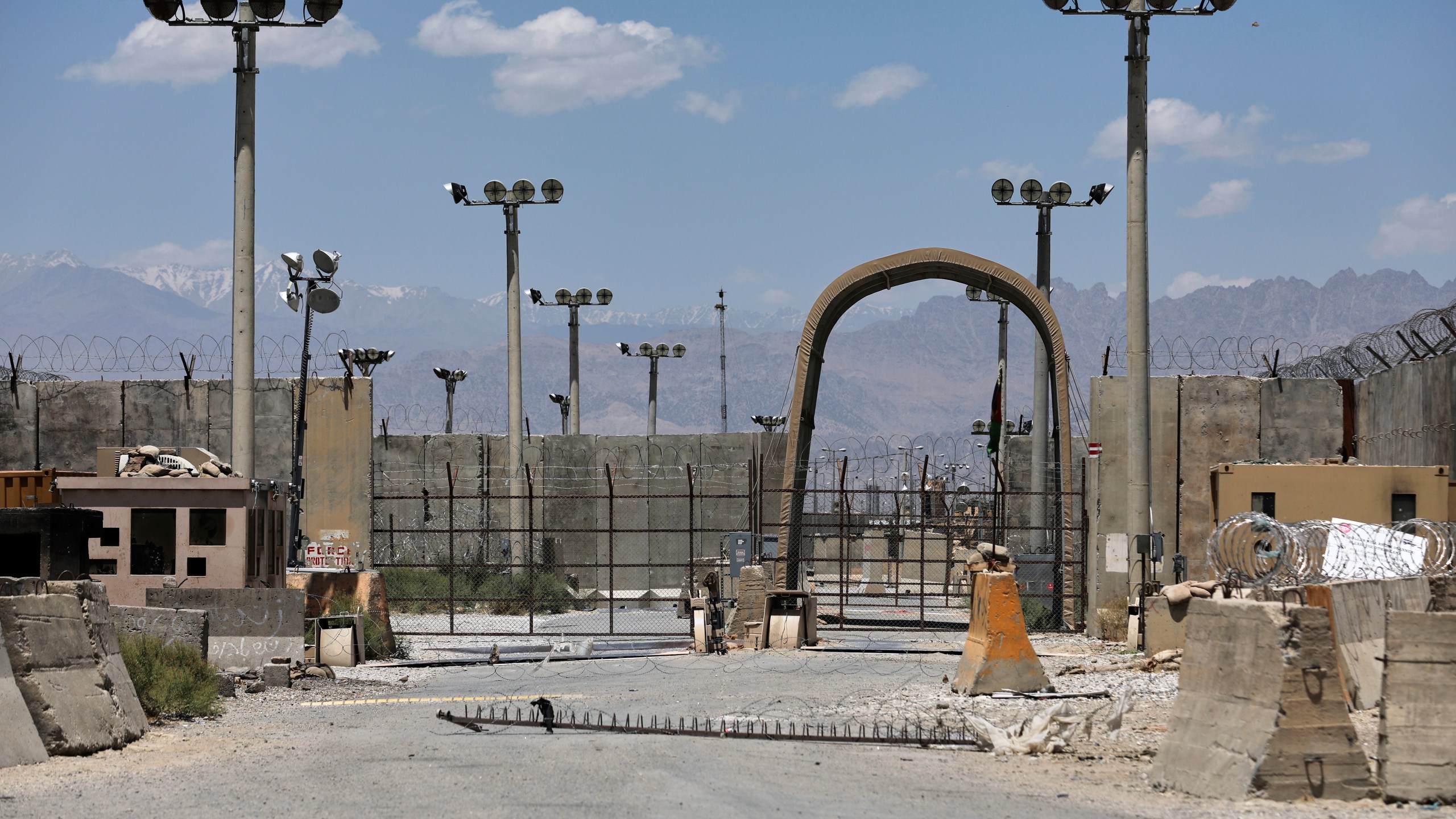 FILE - A gate is seen at the Bagram Air Base in Afghanistan, Friday, June 25, 2021. President Donald Trump has suggested he's working to reestablish a U.S. presence at Bagram Air Base in Afghanistan. That comes four years after America’s chaotic withdrawal from the country left the base in the Taliban’s hands. (AP Photo/Rahmat Gul, File)