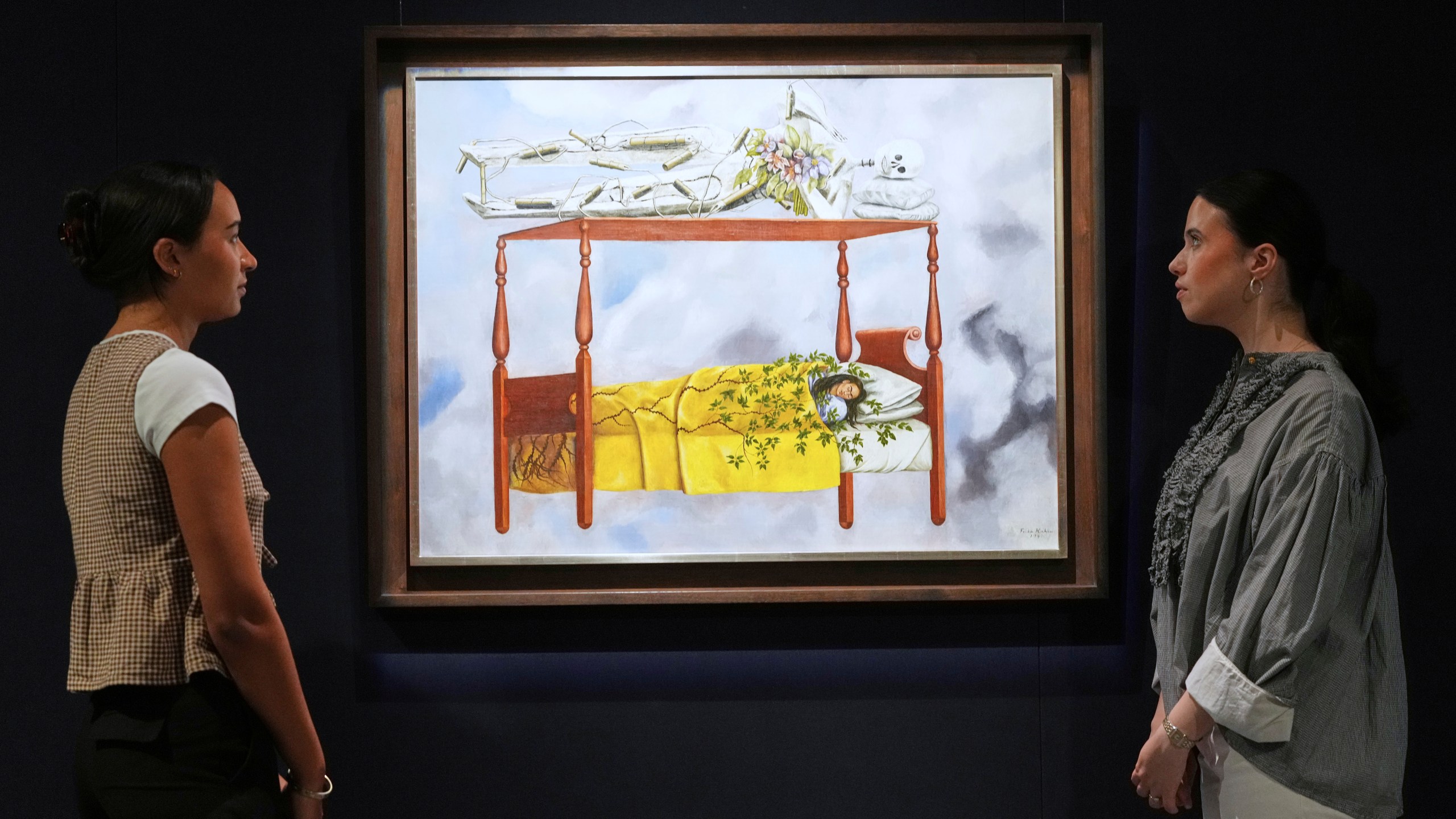 A painting by Frida Kahlo called El sueño (La cama) is displayed at Sotheby's auction rooms, the painting estimated at 40-60 million US dollars is part of a collection of surrealist masterpieces unveiled in London ahead of their sale in New York, Friday, Sept. 19, 2025. (AP Photo/Kirsty Wigglesworth)