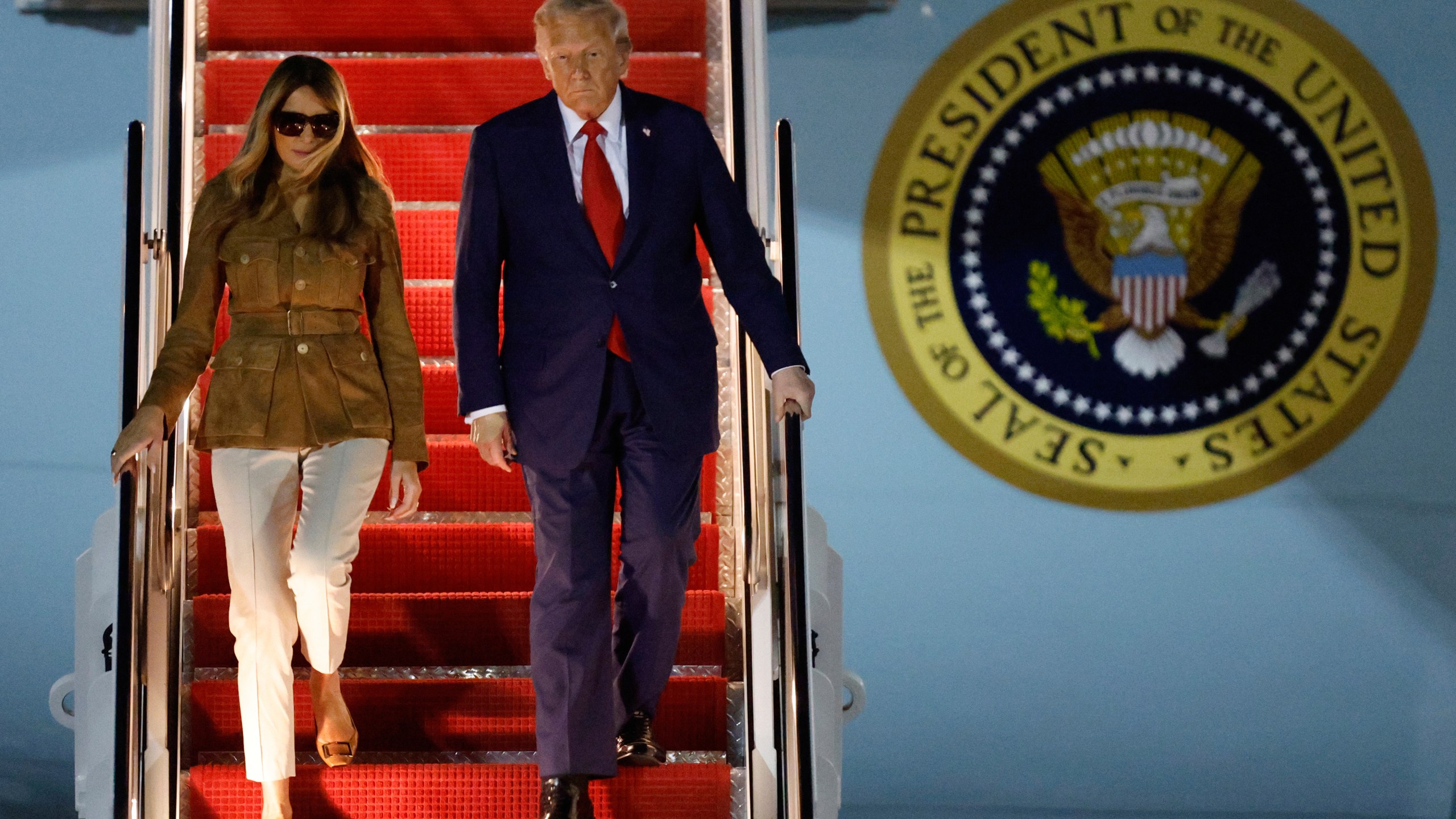 President Donald Trump and first lady Melania Trump disembark Air Force One at Joint Base Andrews, Md., Thursday, Sept. 18, 2025, after returning from a state visit to Britain. (AP Photo/Luis M. Alvarez)