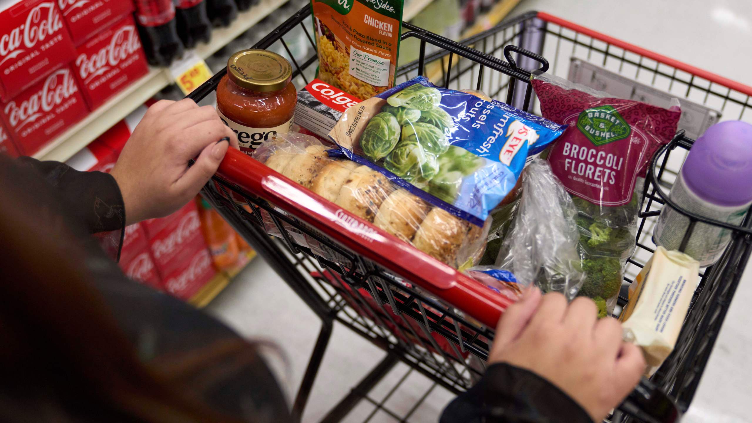 FILE - Jaqueline Benitez, who depends on California's SNAP benefits to help pay for food, shops for groceries at a supermarket in Bellflower, Calif., Feb. 13, 2023. (AP Photo/Allison Dinner, File)