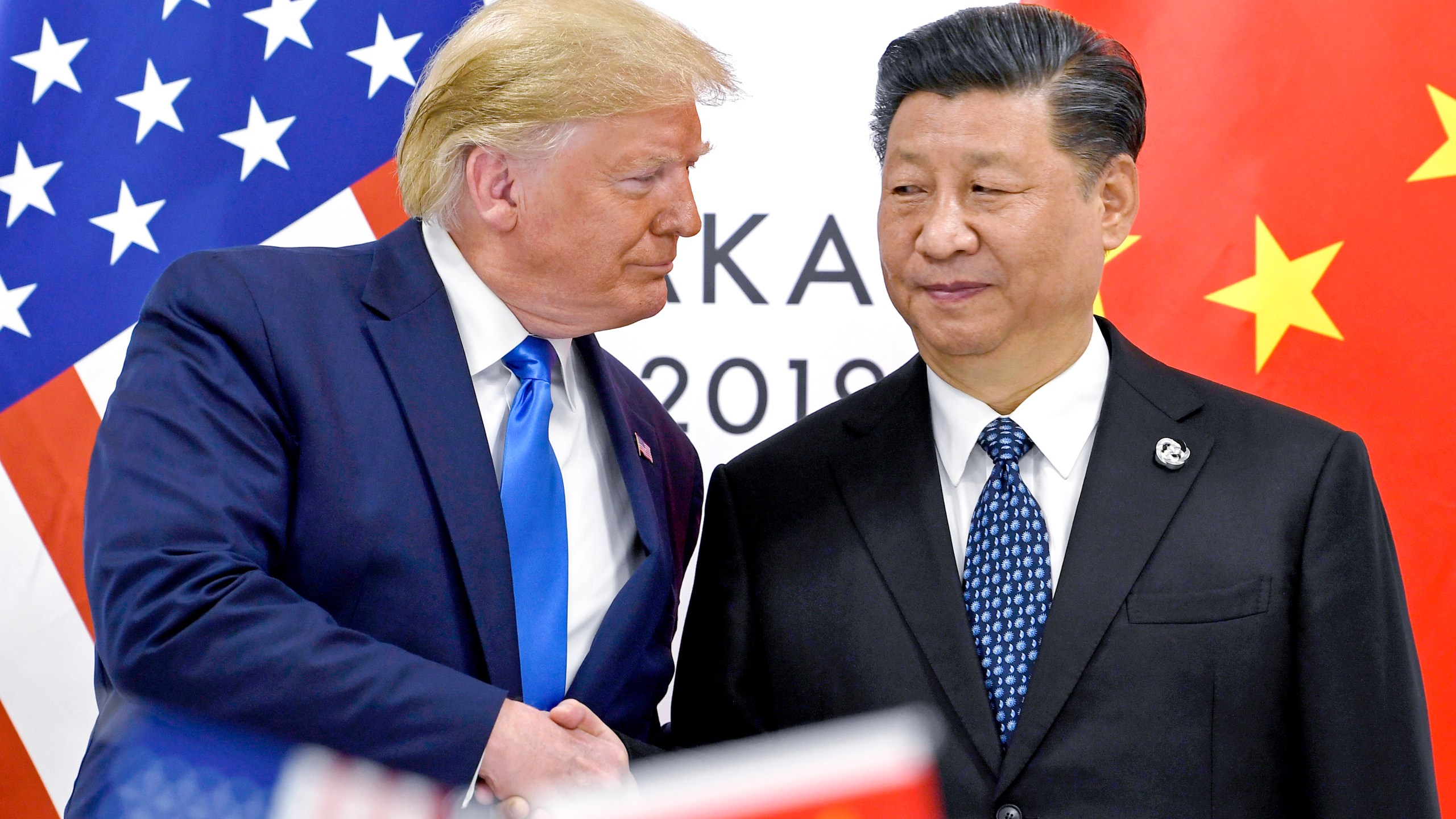 FILE - President Donald Trump, left, shakes hands with China's President Xi Jinping during a meeting on the sidelines of the G-20 summit in Osaka, Japan, June 29, 2019. (AP Photo/Susan Walsh, File)