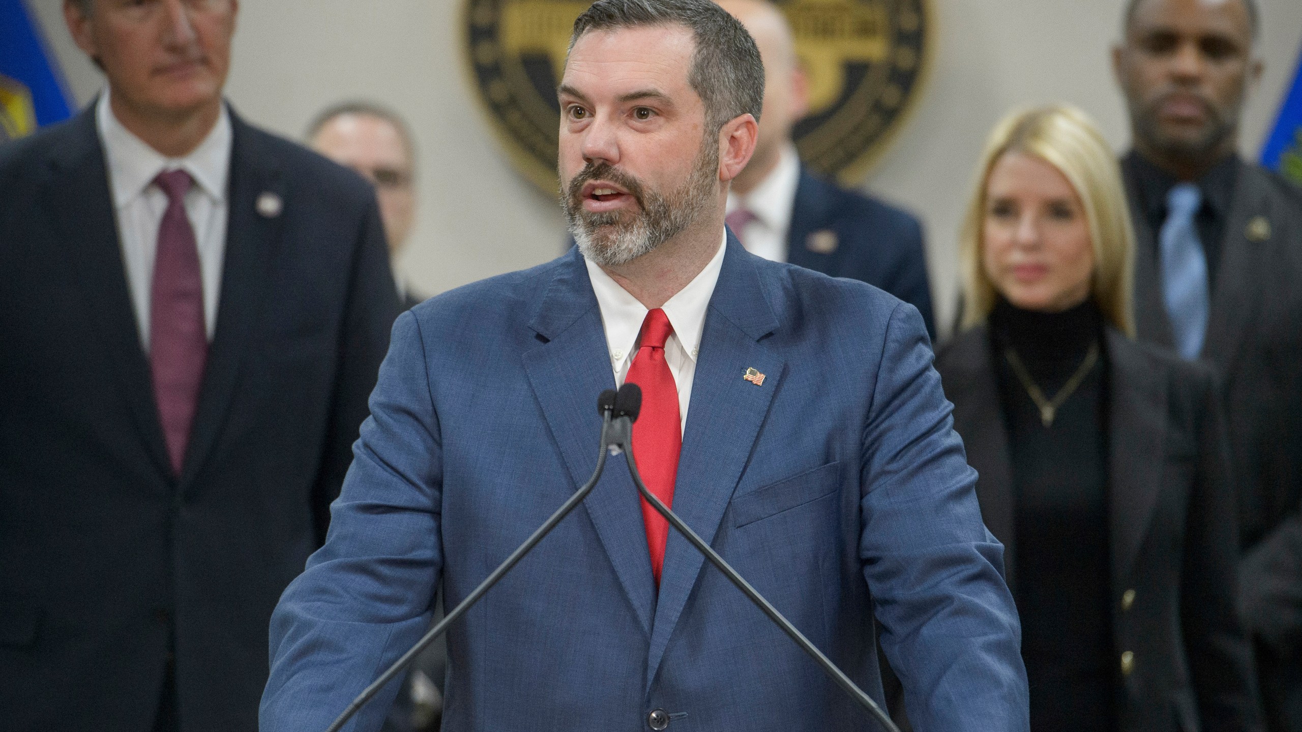 FILE - Erik Siebert, interim U.S. Attorney for the eastern district of Virginia, speaks as Attorney General Pam Bondi, right, and Virginia Gov. Glenn Youngkin, left, listen during a news conference at the Manassas FBI Field Office, March 27, 2025, in Manassas, Va. (AP Photo/Rod Lamkey, Jr., File)
