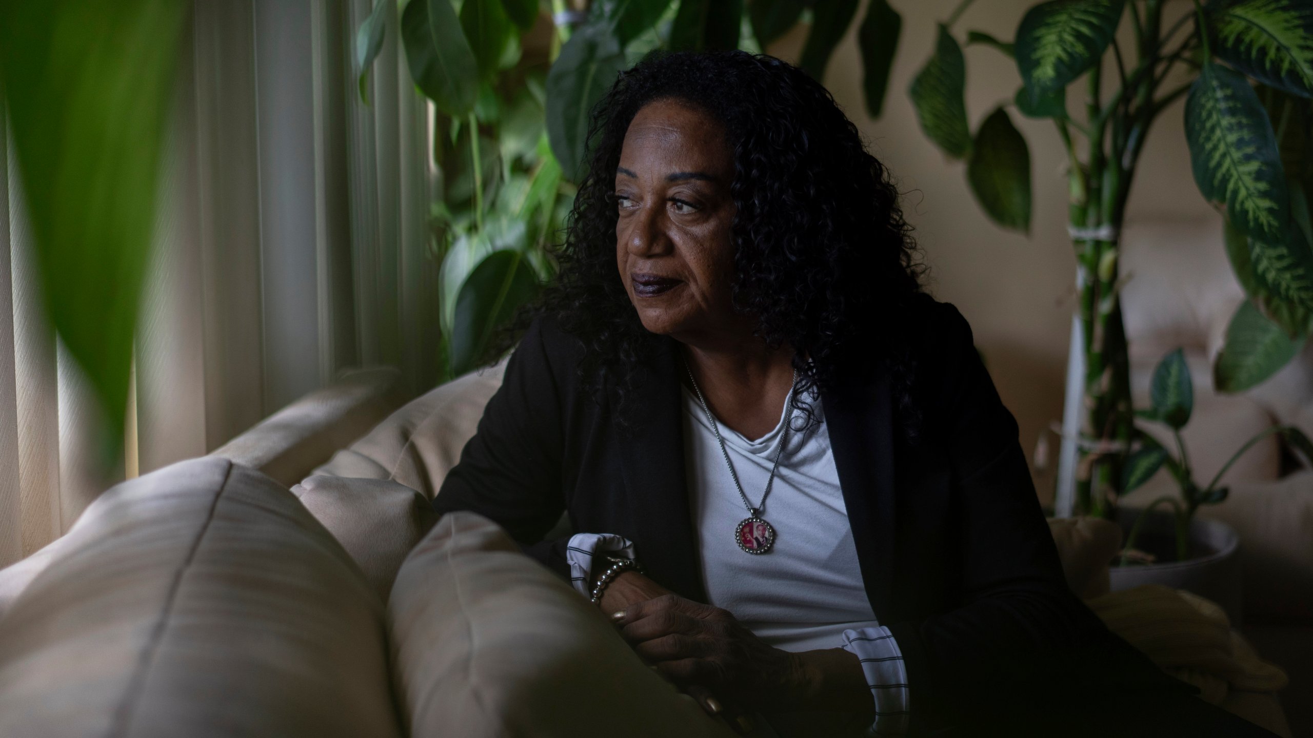 Delphine Cherry looks out from her favorite spot in her home Friday, Sept. 5, 2025, in Hazel Crest, Ill. (AP Photo/Carolyn Kaster)