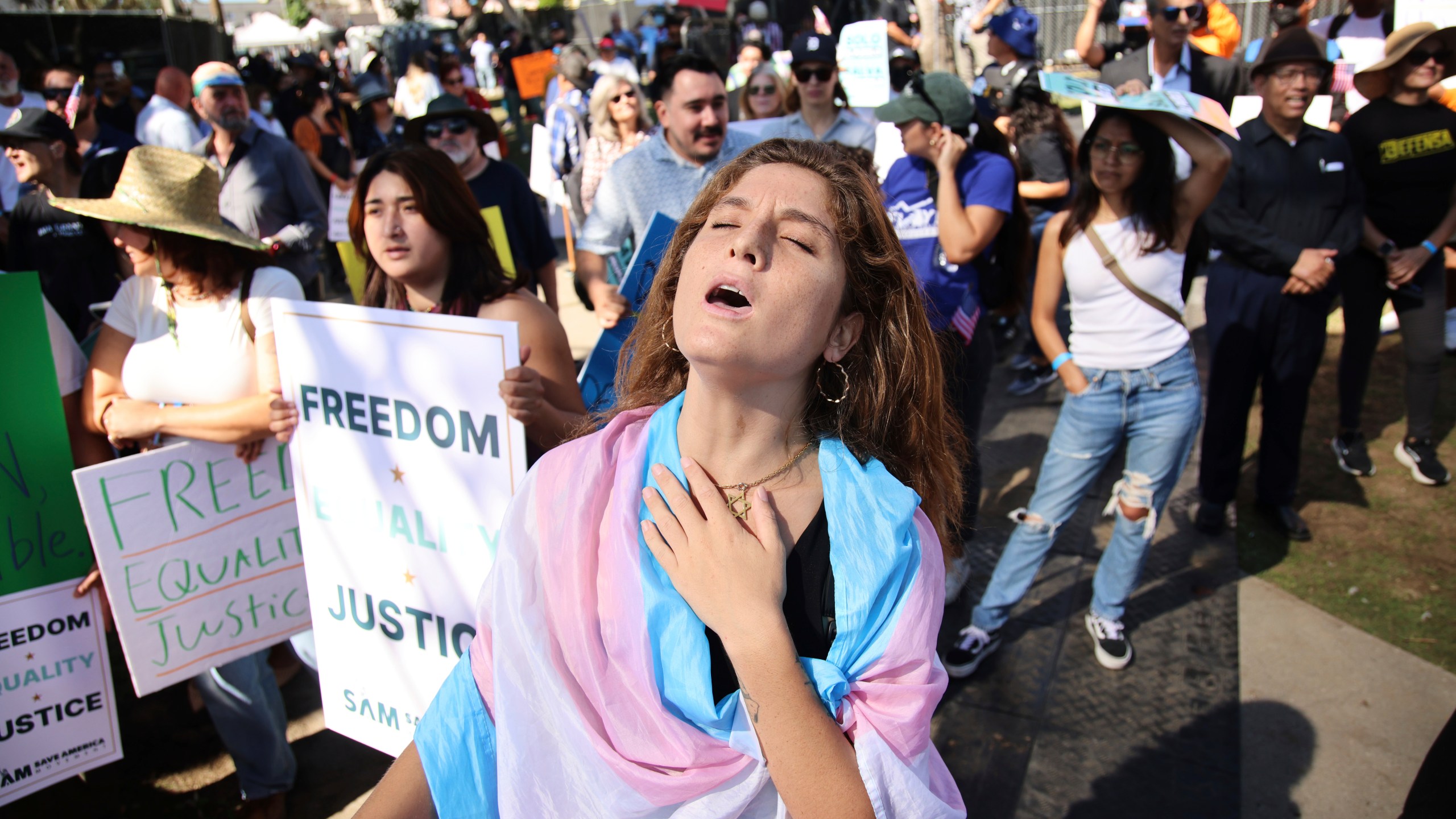 Supporters gather during an immigration rally on Saturday, Sept. 20, 2025, in Los Angeles. (AP Photo/Ethan Swope)