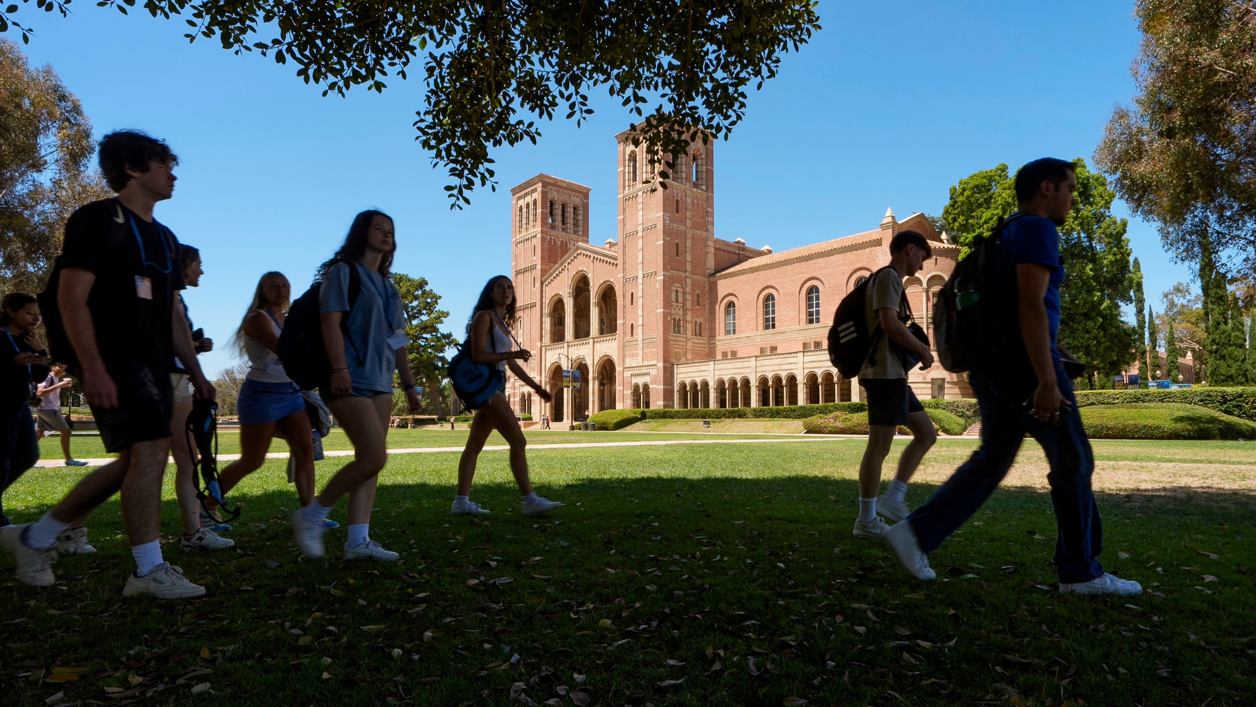 FILE - Students walk past Royce Hall at the UCLA campus in Los Angeles, Aug. 15, 2024. (AP Photo/Damian Dovarganes, File)