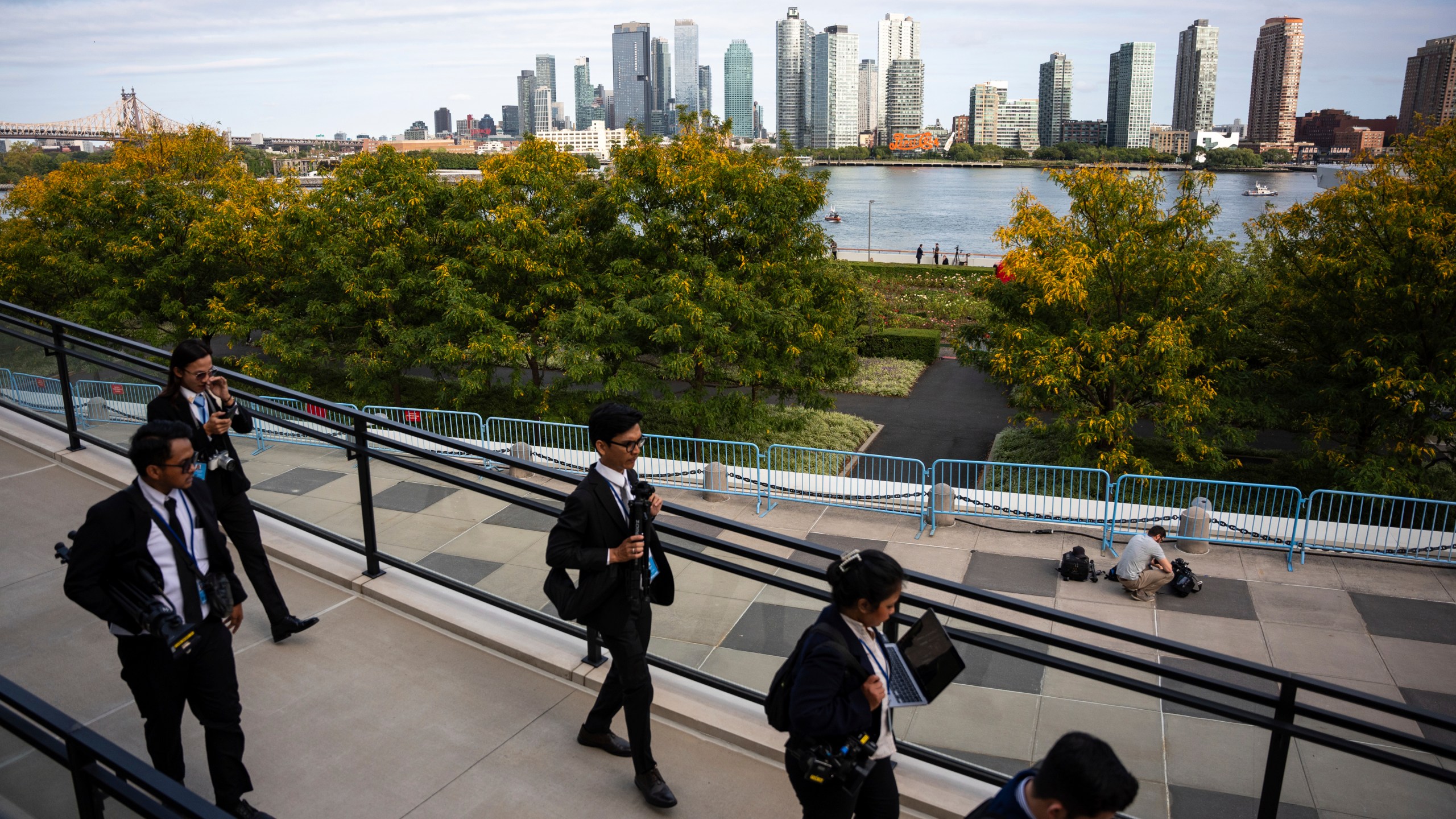 People exit the United Nations Headquarters on the first day of the 80th session of the UN General Assembly's High-Level week, Monday, Sept. 22, 2025. (AP Photo/Angelina Katsanis)