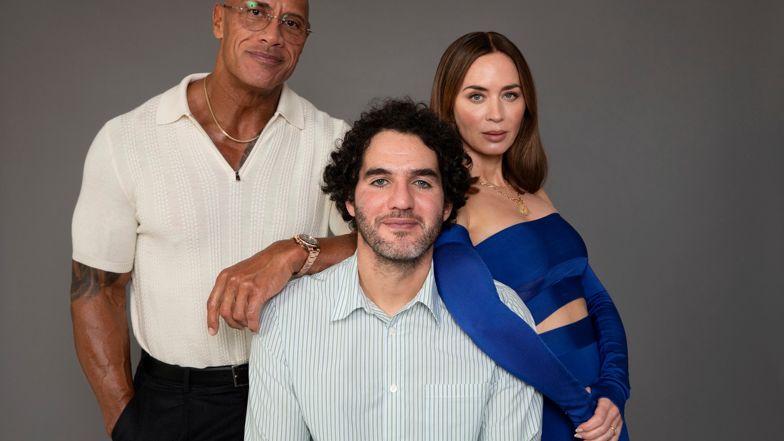Dwayne Johnson, from left, Benny Safdie and Emily Blunt pose to promote their film "The Smashing Machine" on Friday, Sept. 12, 2025, in Los Angeles. (Photo by Rebecca Cabage/Invision/AP)