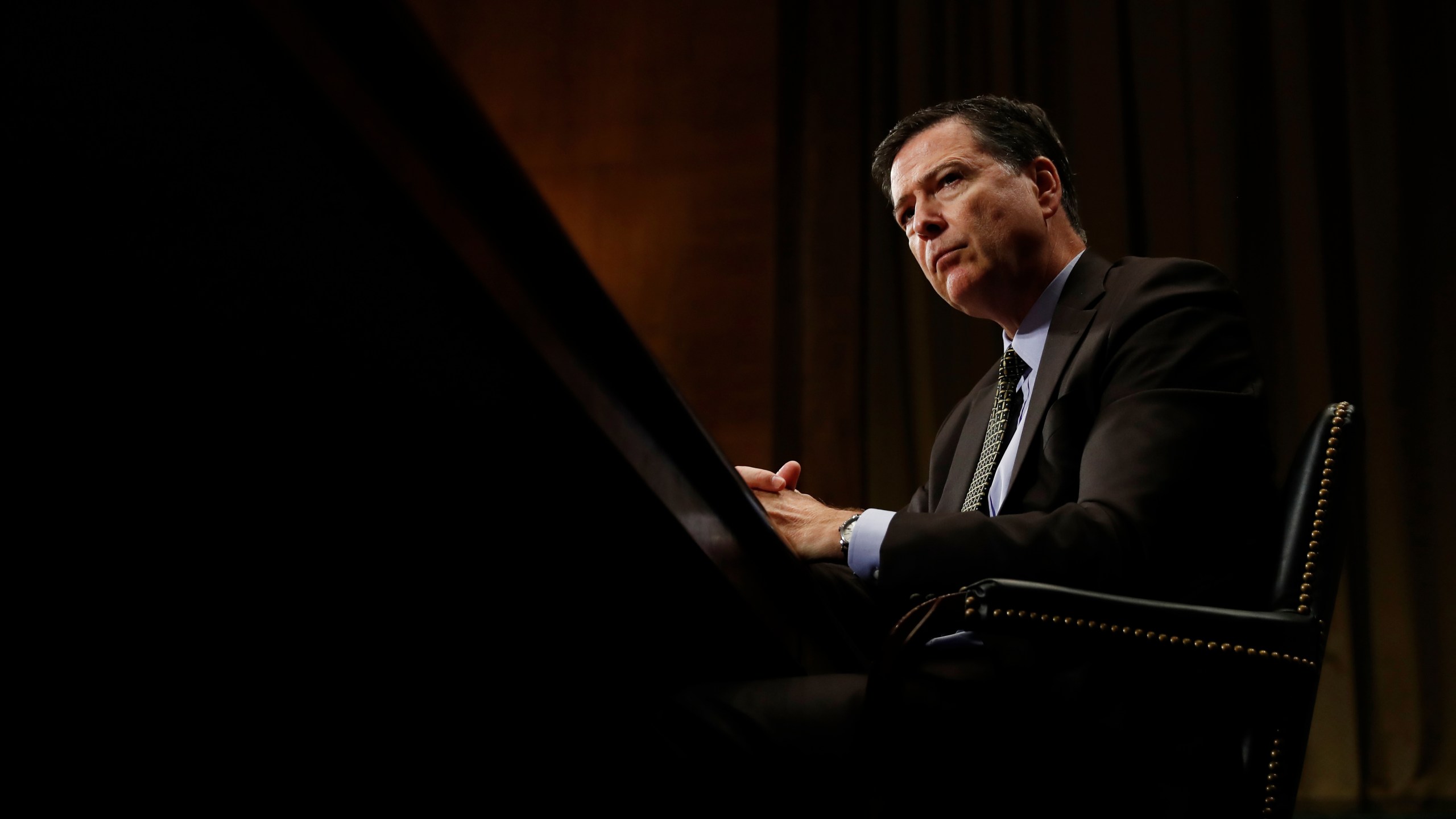 FILE - FBI Director James Comey pauses as he testifies on Capitol Hill in Washington, May 3, 2017, before the Senate Judiciary Committee hearing: "Oversight of the Federal Bureau of Investigation." (AP Photo/Carolyn Kaster, File)